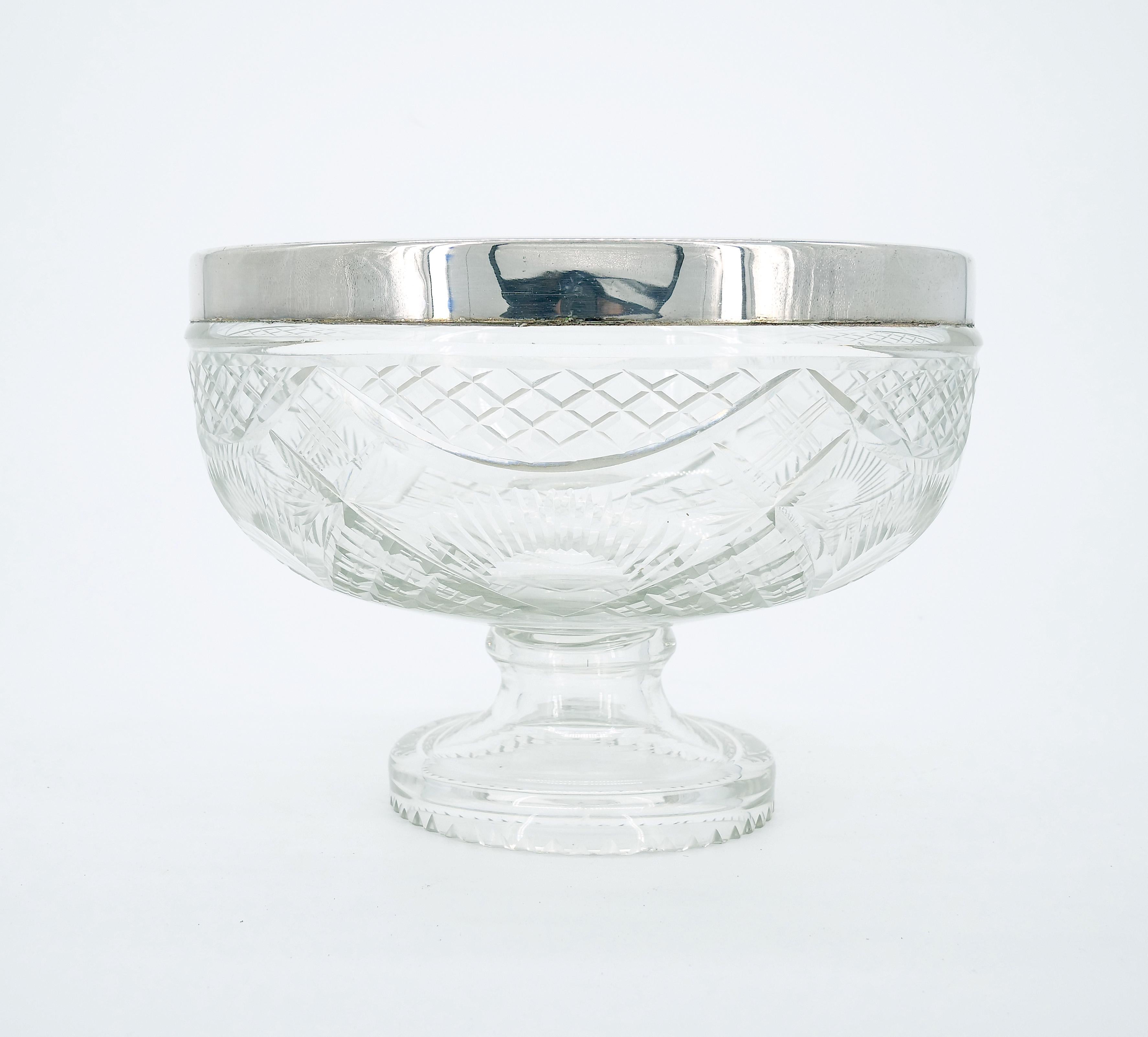 Enhance your table setting with this vintage English Silver Plate Framed Top Cut Glass Serving Bowl by E.P.N.S., a stunning combination of craftsmanship and timeless design. The exterior of the bowl is adorned with intricate diamond-cut details,