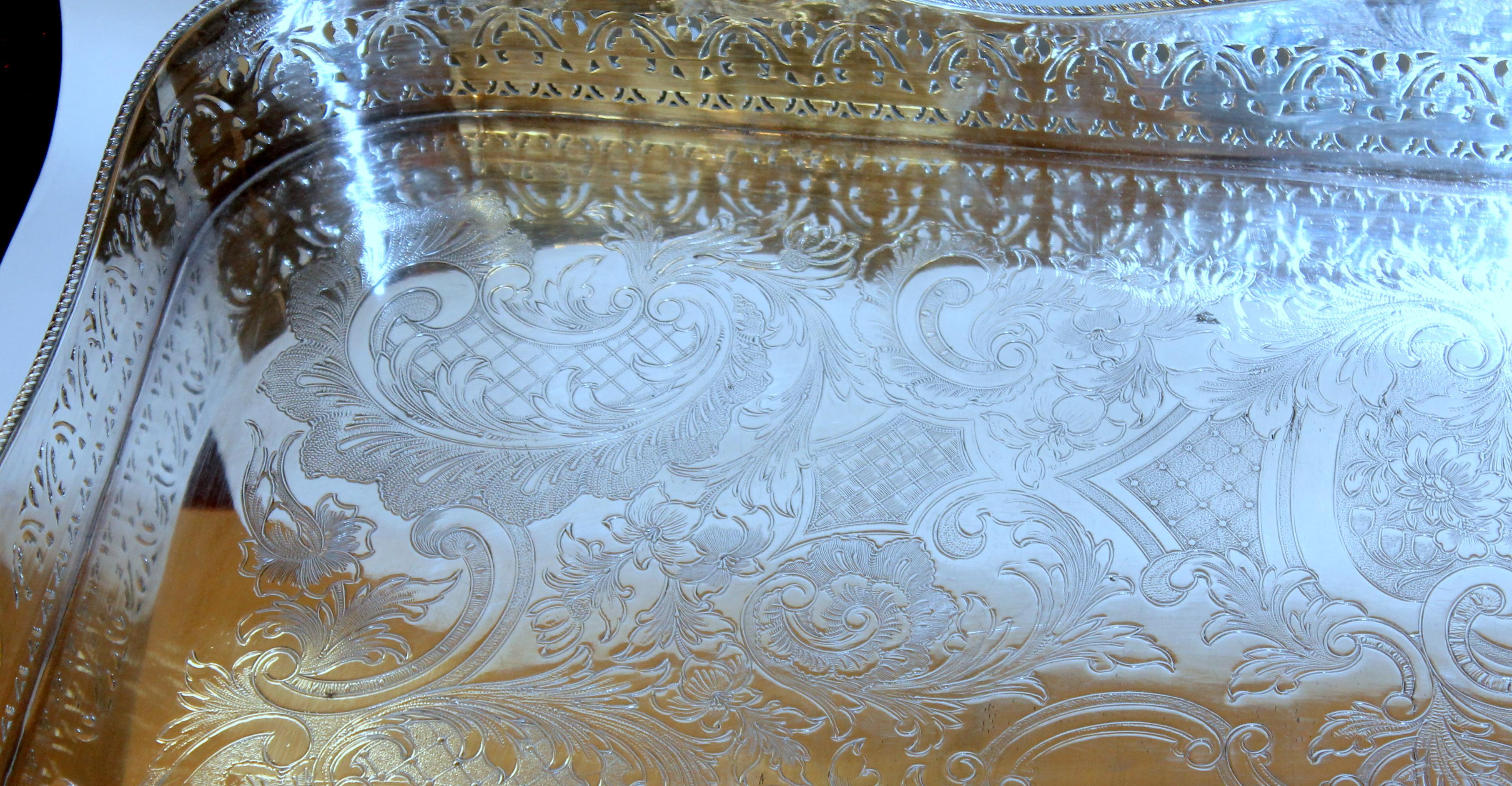 Finest quality Old English silver plate pierced border large rectangular gallery tray with embossed well; superb tall pierced border; cut-out handles.

Maker's marks for Royal Warranted Silversmiths, Ellis Silver Co., Birmingham (predecessor to