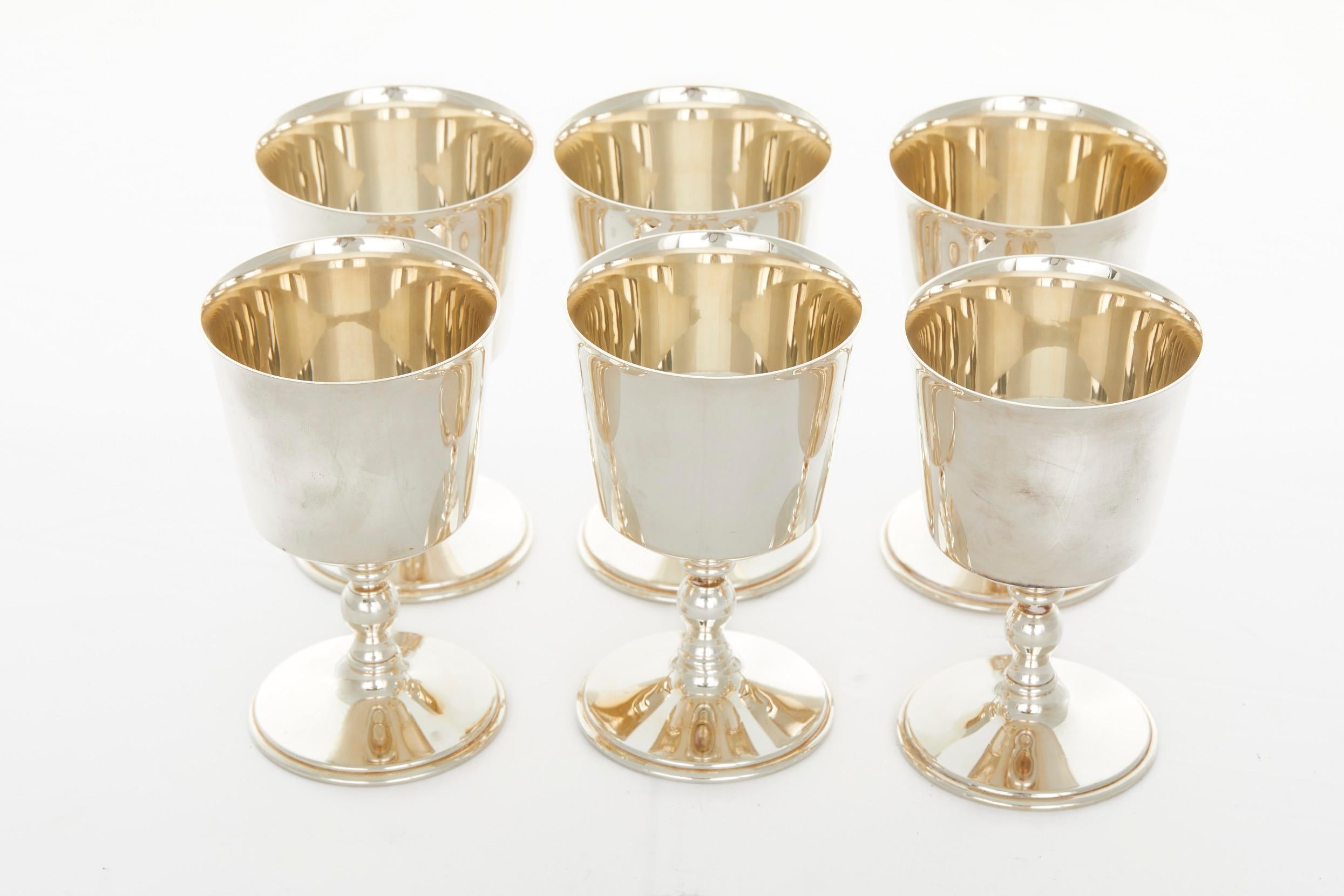 English silver plated Art Deco style barware / tableware drinking goblet service for six people. Each silver cup is in great condition. Minor wear. Maker's mark undersigned. Each cup measures 5.3 inches tall X 3.2 inches diameter.