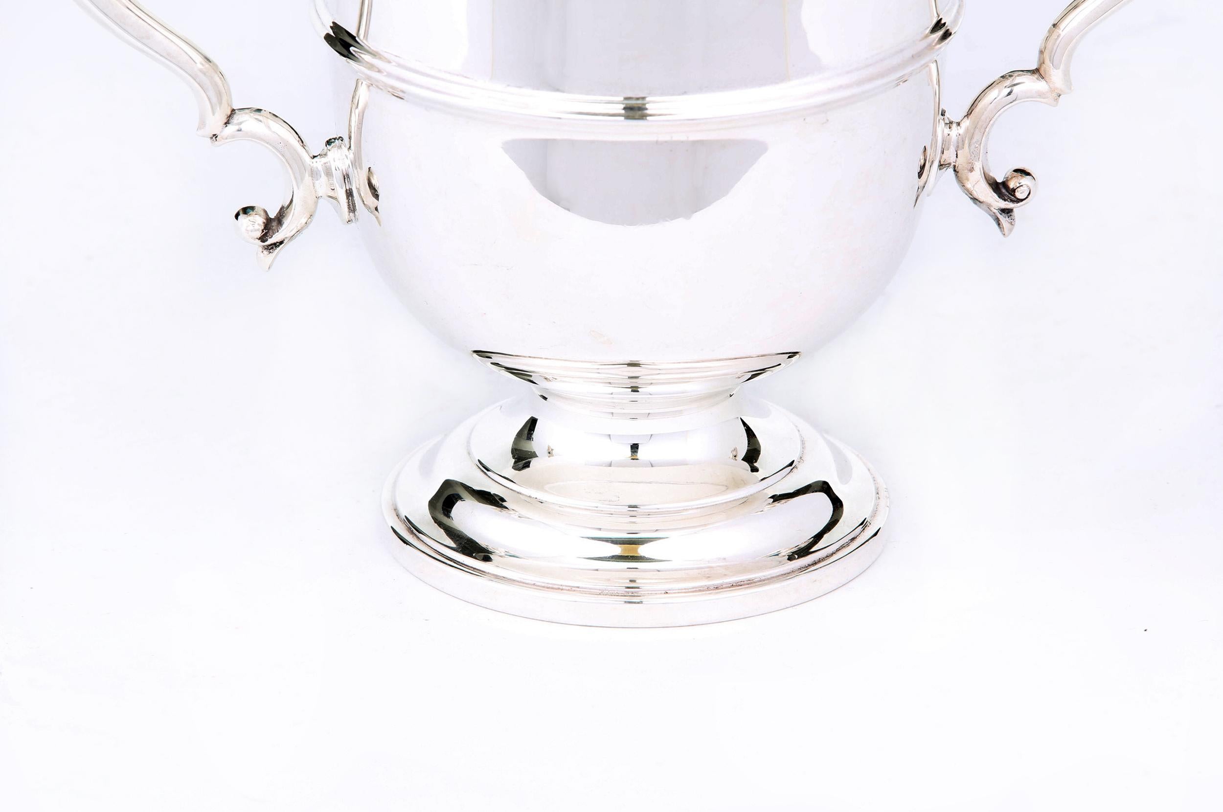 English silver plated barware / tableware ice bucket with exterior design details and side handles. The ice bucket is in great condition. Maker's mark undersigned. The ice bucket is about 10.5 inches diameter x 7.5 inches tall.