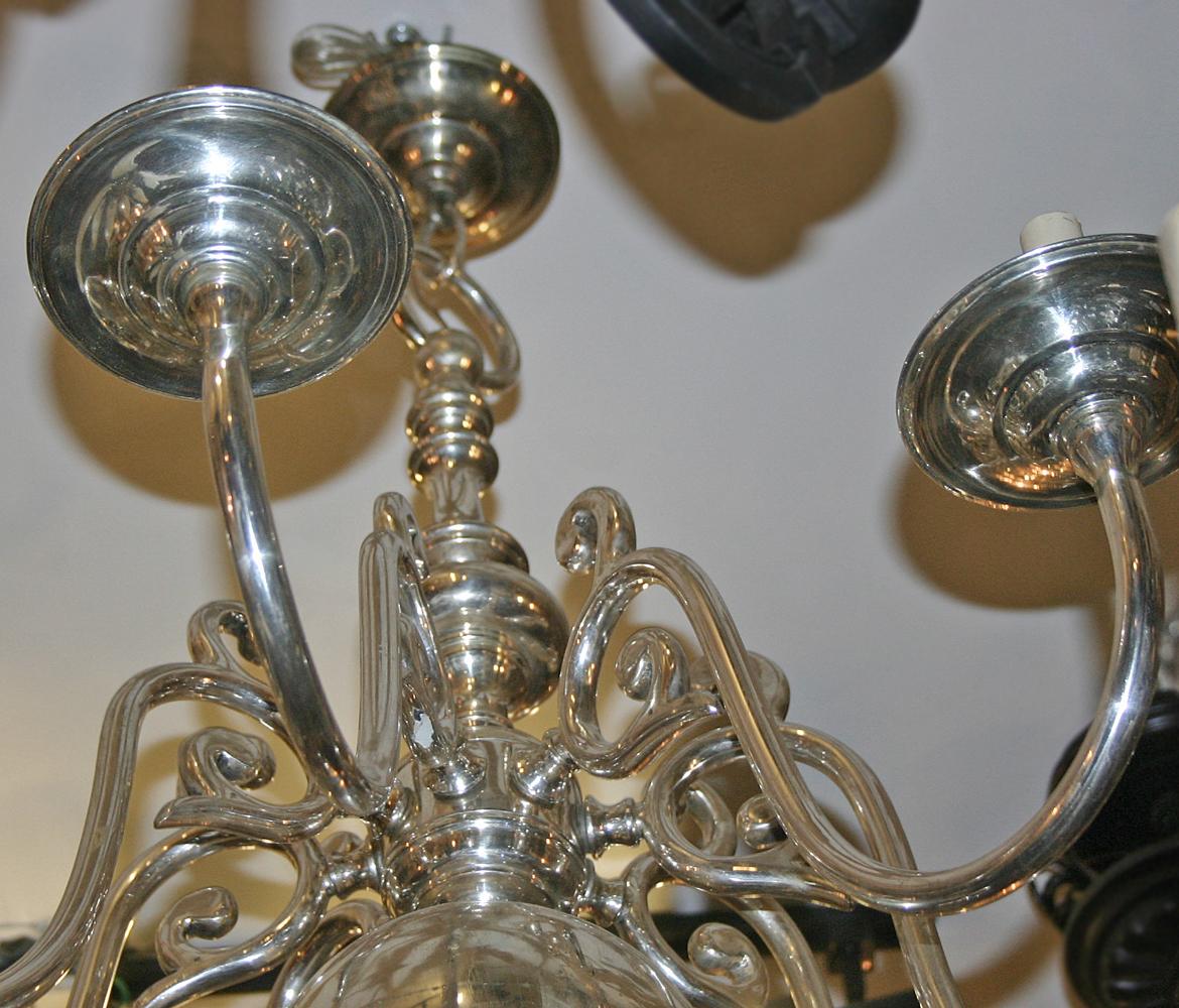 A circa 1930's English chandelier with 6 lights, original finish and patina.

Measurements:
Current drop: 33.5