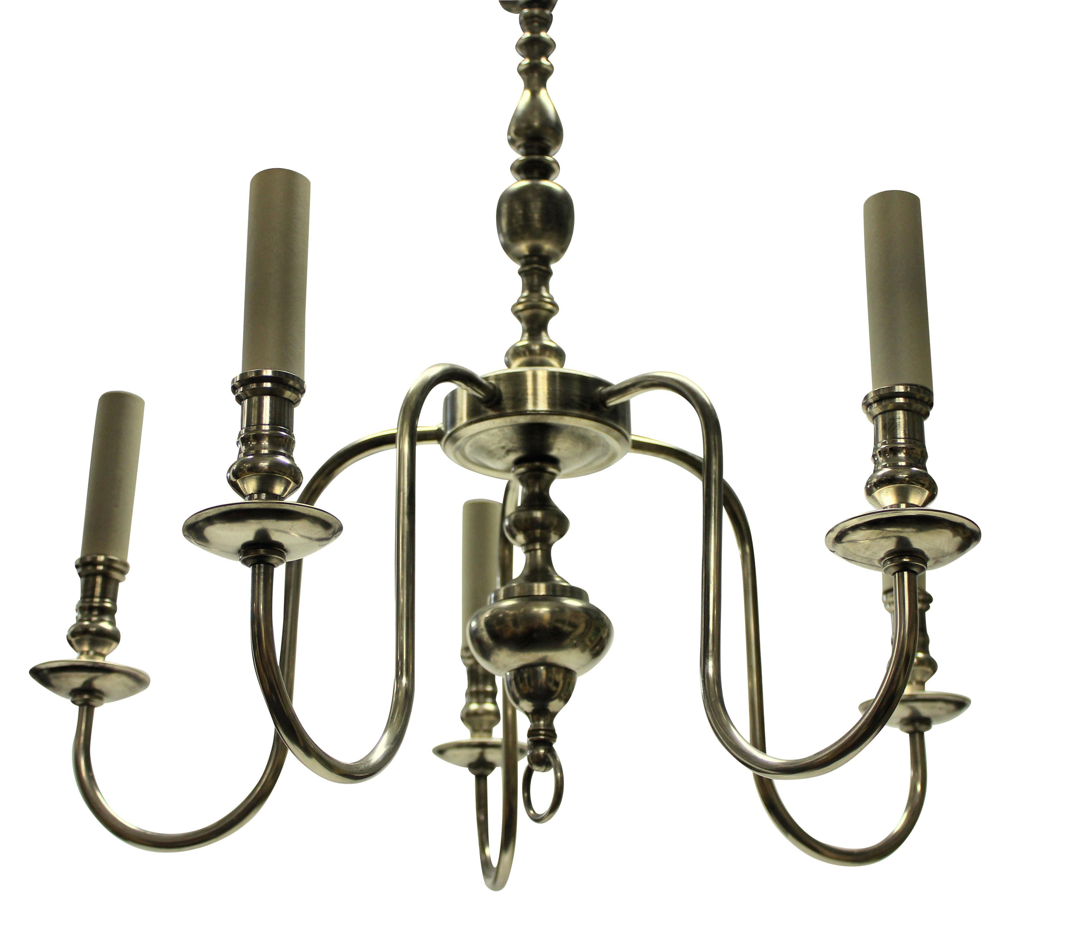 An English silver plated five branch chandelier, of simple linear design.