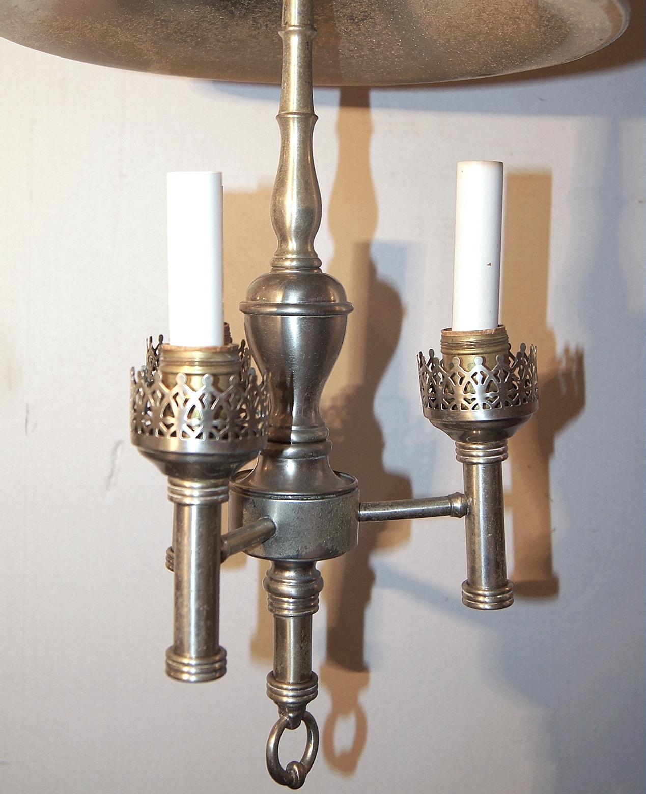A circa 1940's English three-light pewter chandelier with original patina and with shade.

Measurements:
Height: 21.5