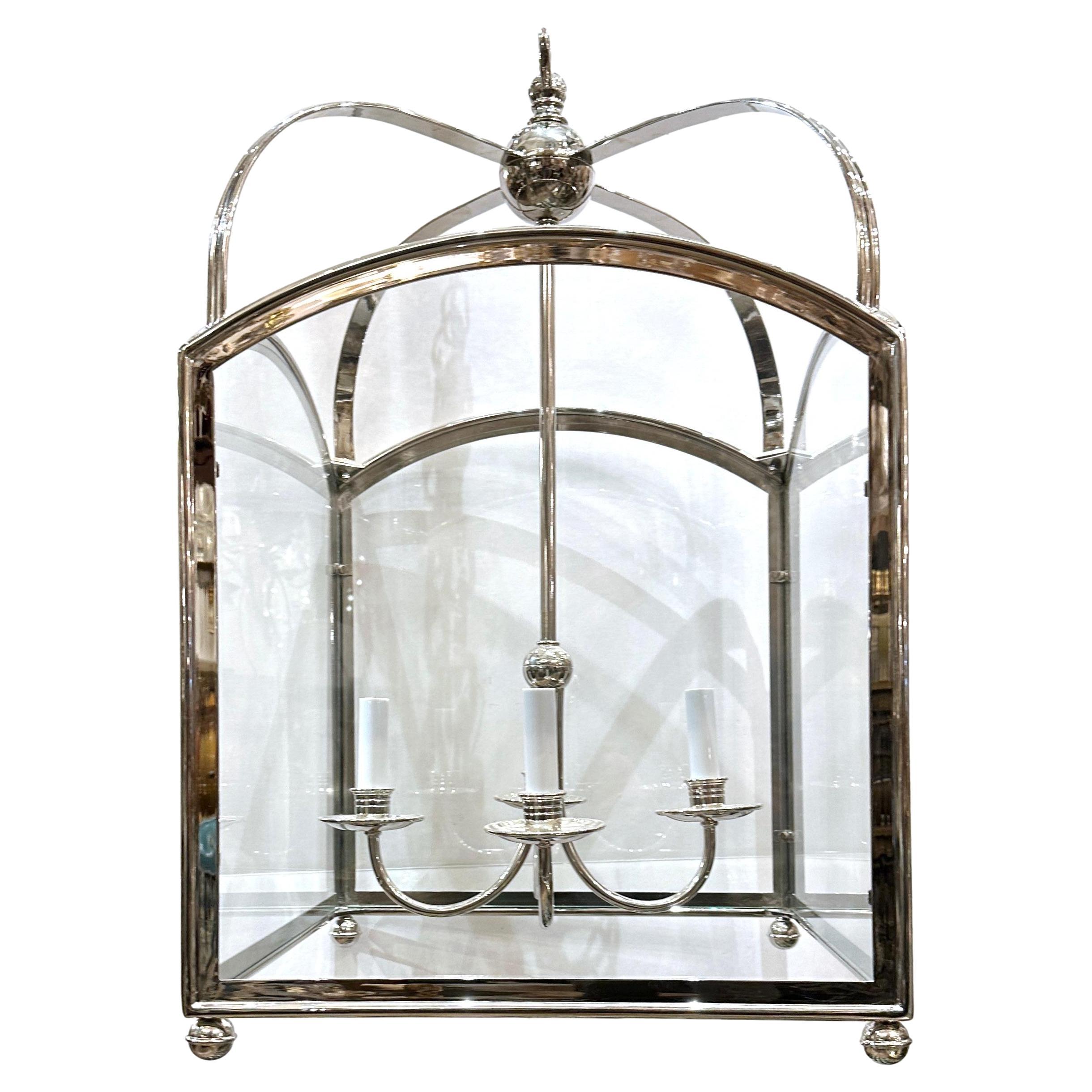 A circa 1970's English silver-plated square lantern with four interior lights.

Measurements:
Minimum drop: 31