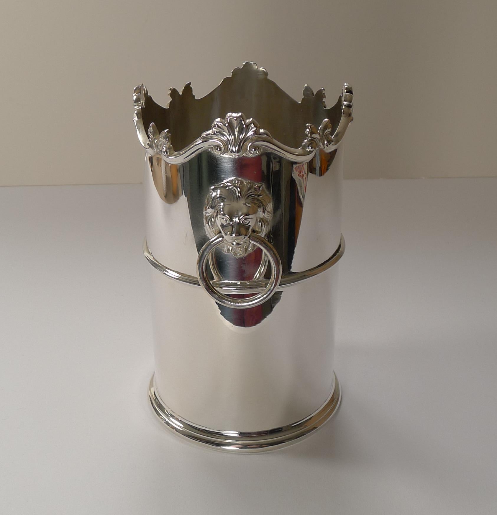 A wonderful late Victorian or Edwardian bottle holder / Coaster in silver plate just back from our silversmith's workshop having been professionally cleaned and polished, restoring it to it's former glory.

Each side of the holder are two large