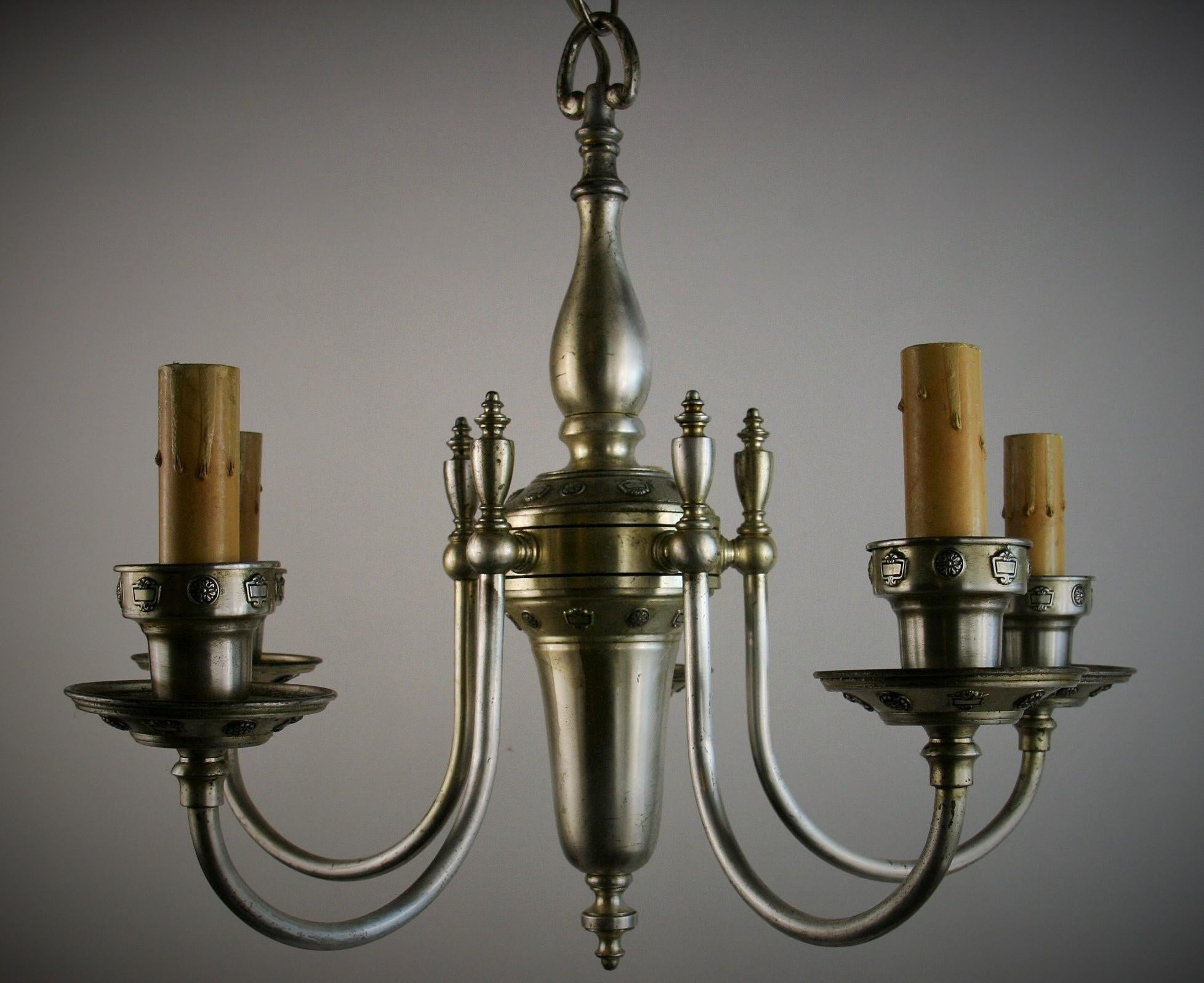 1594  English Silver plated brass 5 light chandelier circa 1920
Rewired 
Taked 60 watt max candelabra based bulbs