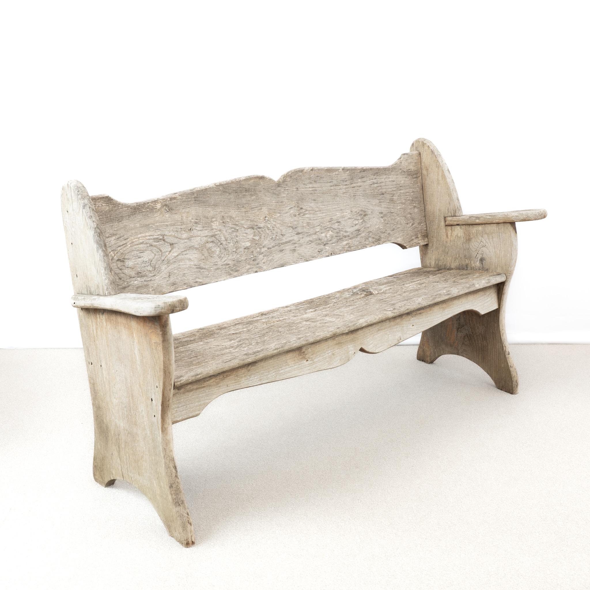 A solid,  English Teak Garden Bench, with a rounded moustached shaped back.

England, circa 1960.

Length - 157.5 cm
Back Height -85 cm 
Arm Height - 64.5 cm
Depth - 54 cm 
Please message if any further info or photos are required 
SHIPPING
The