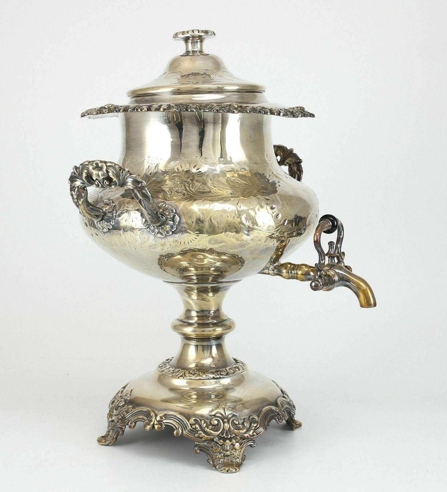 English Silverplate Hot Water Kettle Hand Chased with Flowers, 19th Century

Hand chased Floral Design with vacant centered shield and applied floral handles on a walkable base. This piece contains Silverplate on copper indicative of its age.