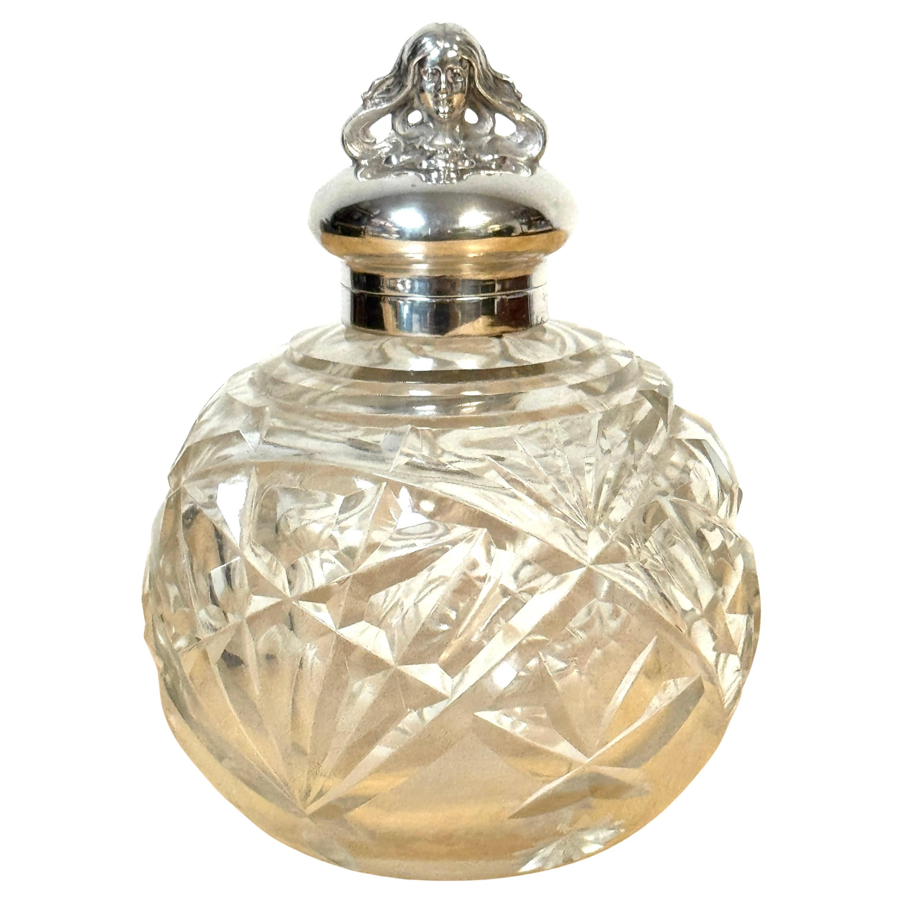 Botella de perfume inglesa plateada con figura de ninfa y cristal tallado, circa 1905
