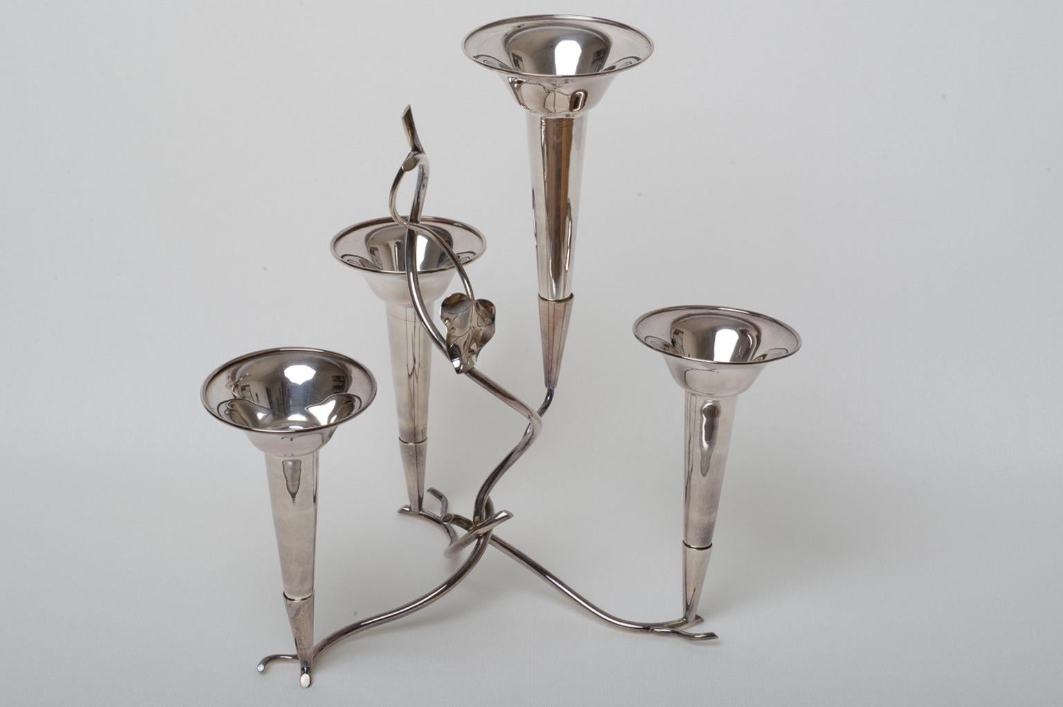 Simple but nice épergne in silver plate for Your table ornament, specially for Christmas: with candles, flowers and fruits all around.  Just a few flowers are enough to refine a table or a piece of furniture in the hall.
I have a large collection of