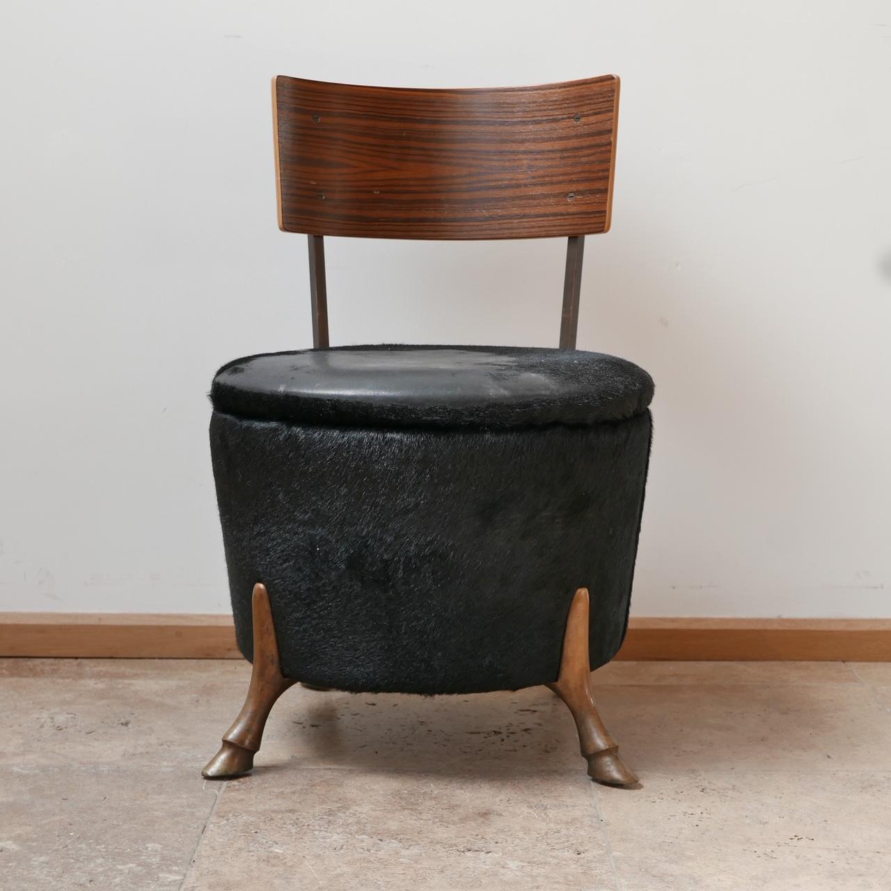 English single unusual mid-century bronze horse leg occasional chair.


A highly unusual horse legged occasional chair. 

Perfect as a vanity chair. 

Covered in a natural material likely horse hide, but lacking in some places (see photos).