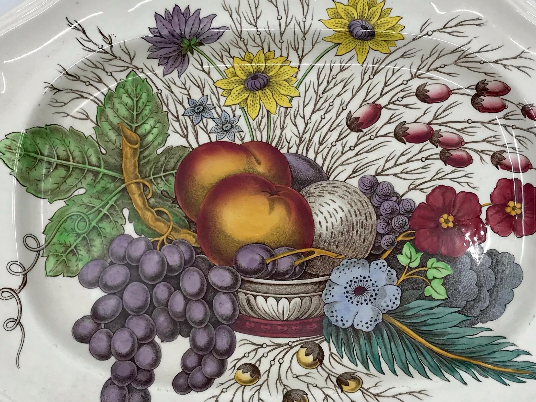 English small harvest platter. Small serving platter with fruit basket and flowers in autumnal colors with markings for Copeland Spode. England, mid 20th century. 
Dimensions: 12.25” W x 9.5