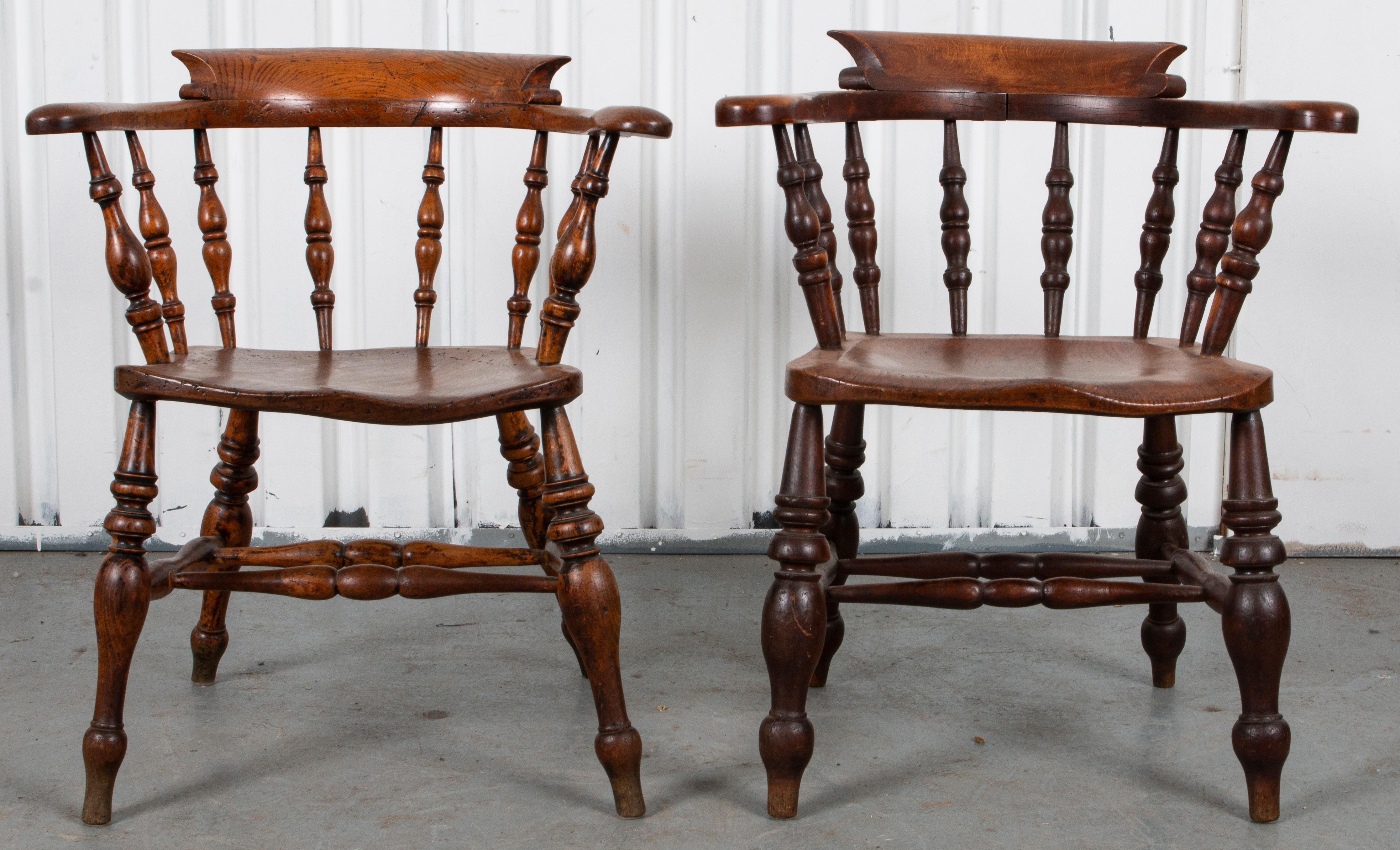 Pair of English figured yew wood Captain / Smoker Bow chairs, late 19th century, throughout with turned spindle elements, the horseshoe shaped back and arm rests above the conforming plank seat.