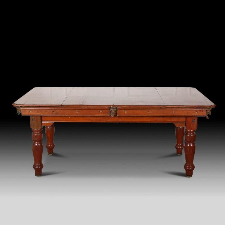 4 leaf top diner table circa 1910. Walnut and Mahogany. The legs have a rise and fall for playing then eating for height adjustment made by the Billiard Table Builders W Jelks & Sons Ltd of 263/275 Holloway Road, London. Has all the balls, cues,