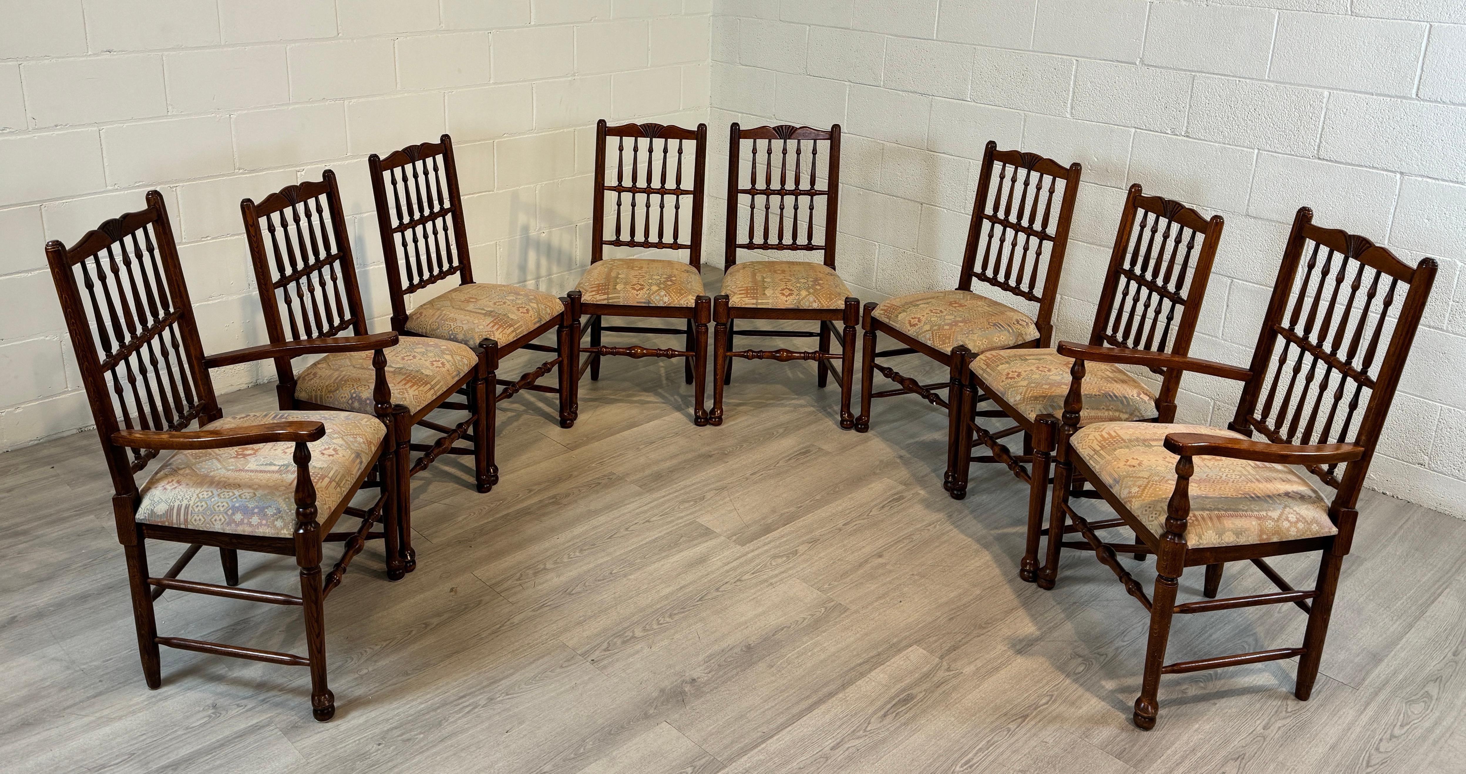 A quality set of English Oak Spindle Back Dining Chairs.  The set consists of two with arms and six without arms to give a well proportioned arrangement around your table.  The seats are easily removable to allow for an easy update to the cushions. 