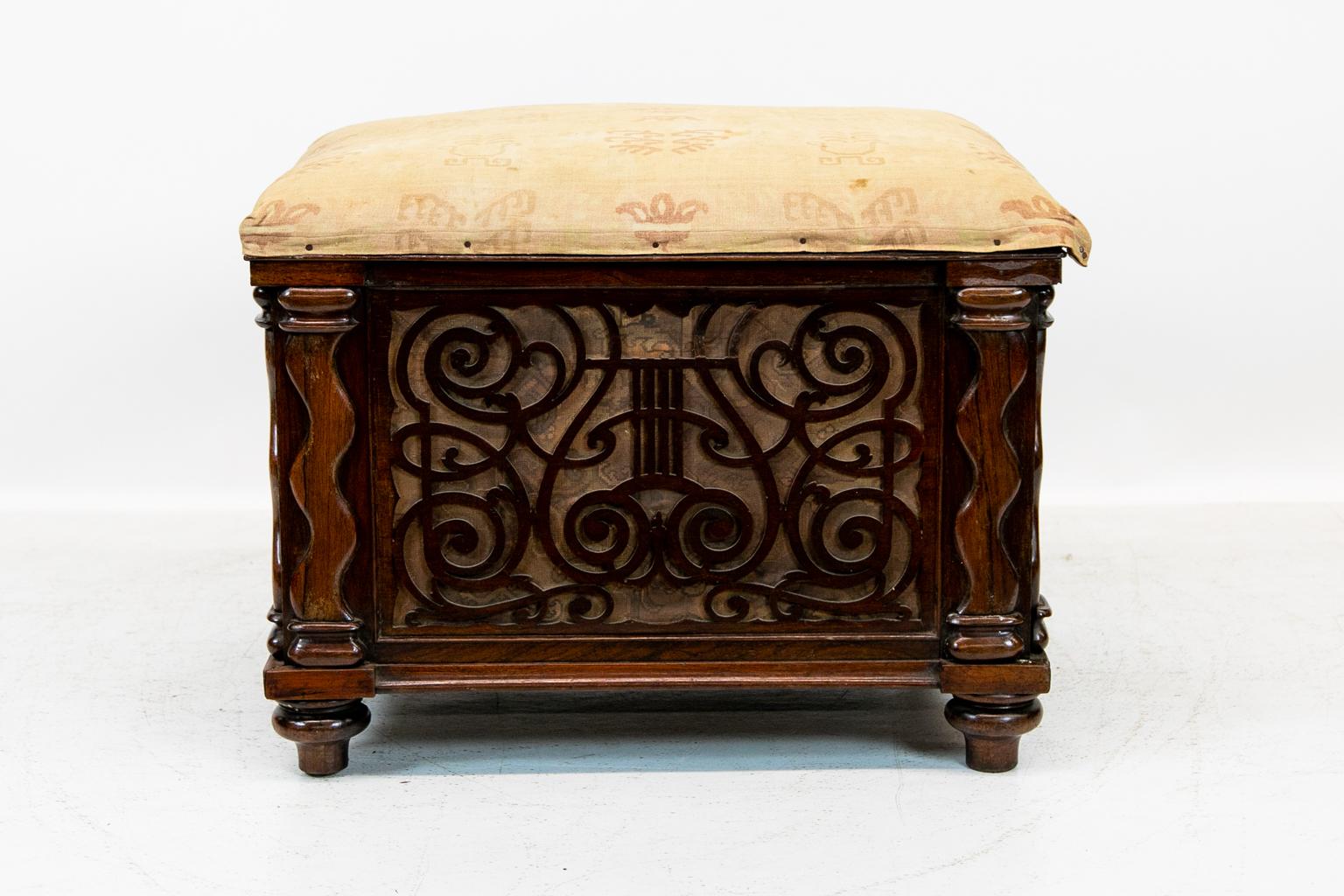 English solid rosewood barley twist stool, has reticulated carved lyre framed with beaded rosewood with a paper background. It rests on original bun feet and brass castors. The damask fabric has discoloration, wear, and a 1.75 tear.