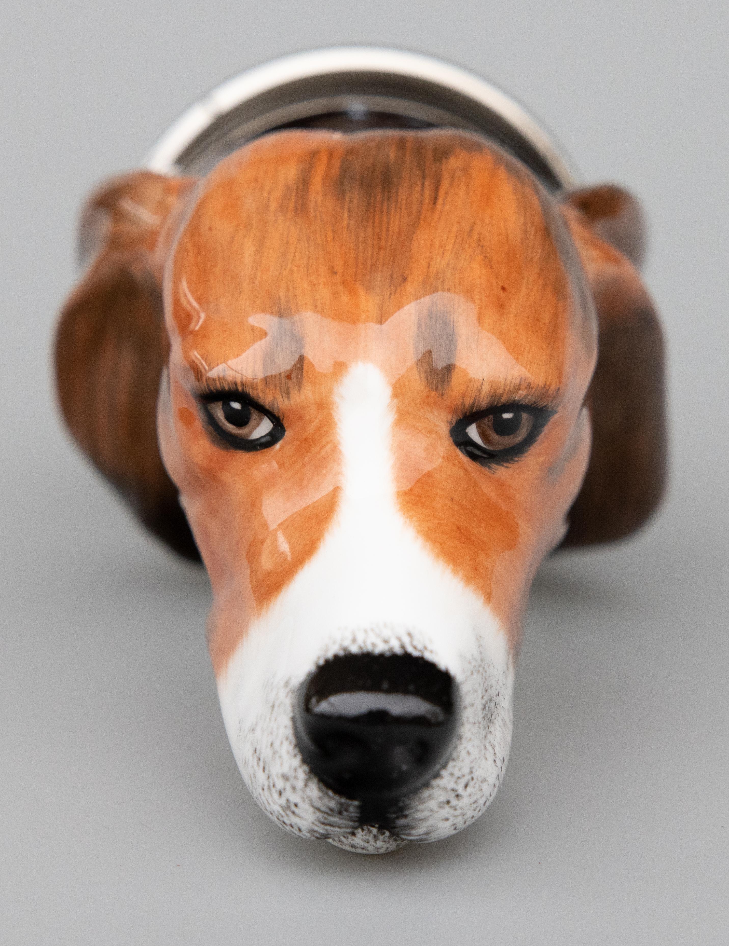 A fine rare vintage English Staffordshire Beagle hunting hound dog porcelain stirrup cup produced by Royale Stratford, in England, circa 1980. Acquired from a collector's estate in England. This charming stirrup cup is in the form of a Beagle dog's