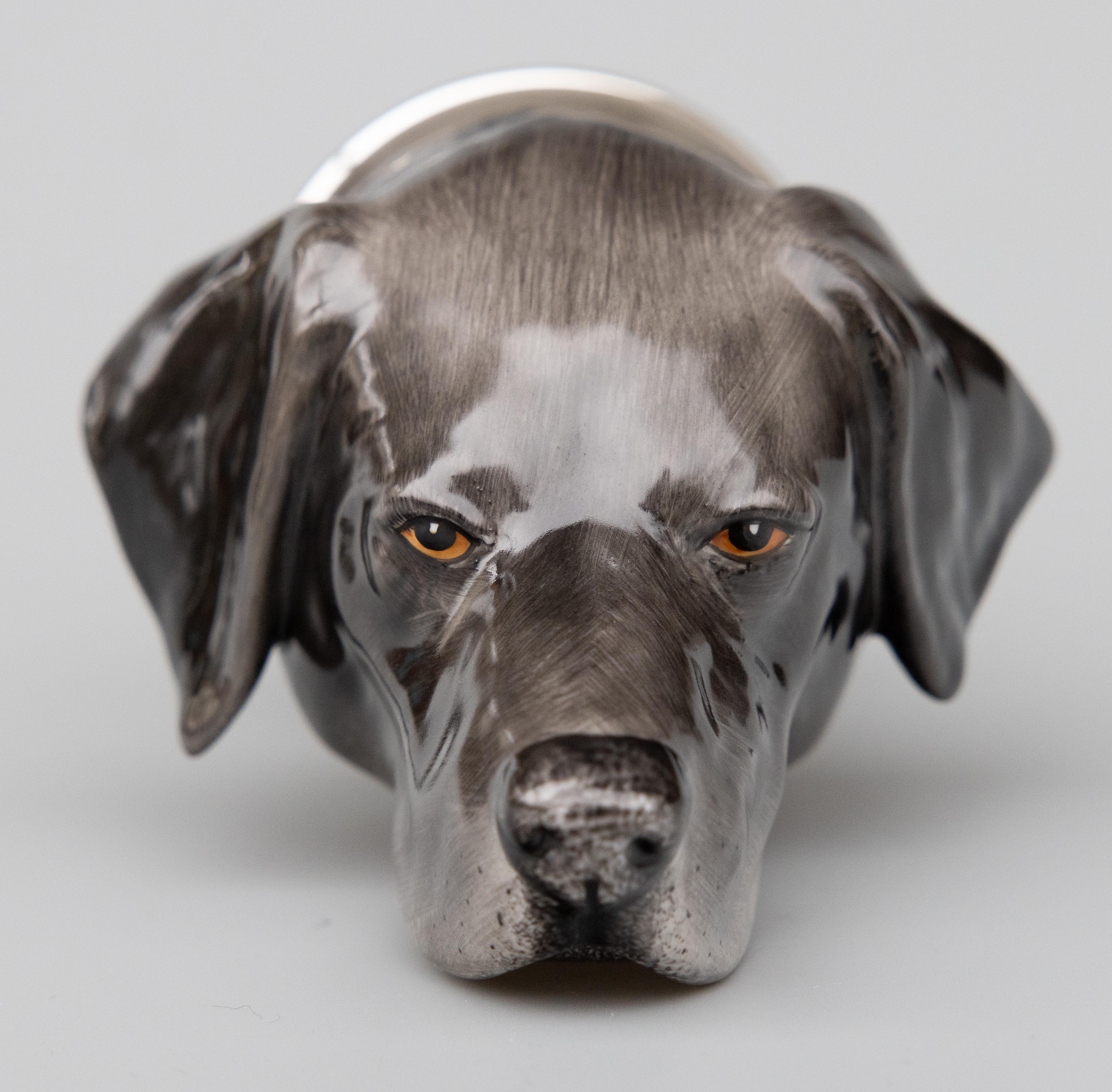 A fine rare vintage English staffordshire great dane hunting dog porcelain stirrup cup produced by Royale Stratford, in England, circa 1980. Acquired from a collector's estate in England. This charming stirrup cup is in the form of a Great Dane