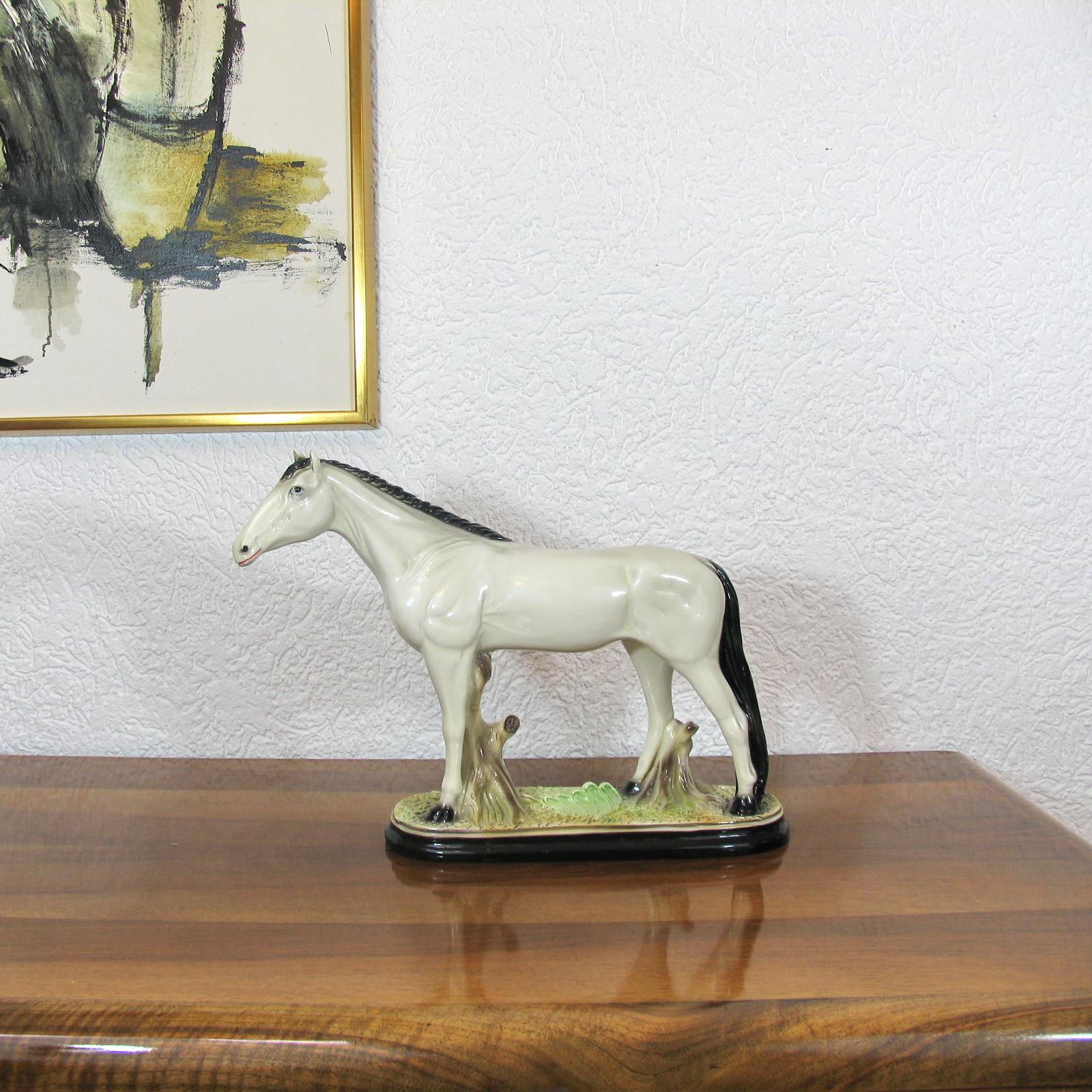 Very decorative white Staffordshire Horse dating from the end of the 19th century, early 20th century. Modeled in a standing stance with the head held high. Excellent hand-painted details. It is in lovely, clean condition overall, except for a small