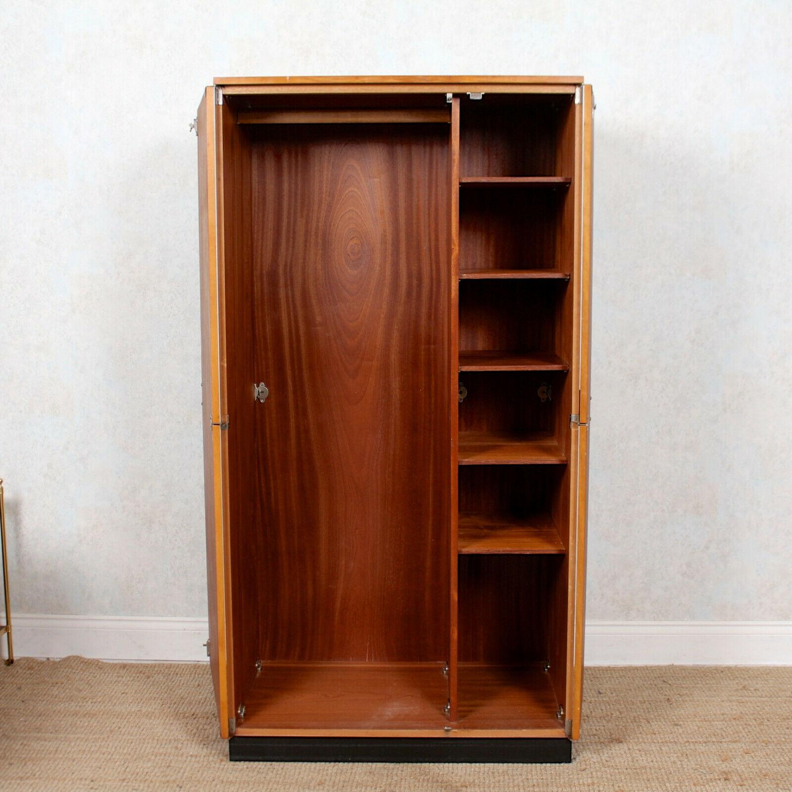 An impressive and rare model compactum wardrobe by Stage.
The fully retractable doors, mounted with good original handles, enclosed hanging rail, shelving and raised on an ebonized plinth base.
England, circa 1975.
