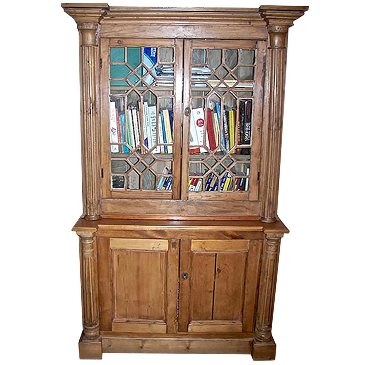 English 19th century stained glass cabinet with two glass doors and two shelves with original glass.
This is the top half of a 2-piece library bookcase.
Other Measurements.
Bottom H 32''; W 44.5''; D 18.5''. $1,500
Total H 77.50''; W 47''; D 18.50''