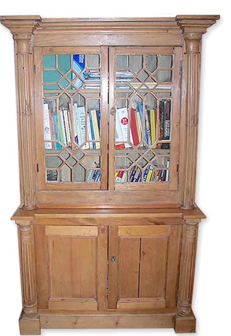 English 19th century stained glass cabinet with two glass doors and two shelves with original glass.
This is the top half of a 2-piece library bookcase.
Other Measurements.
Bottom H 32''; W 44.5''; D 18.5''. $1,747
Total H 77.50''; W 47''; D 18.50''