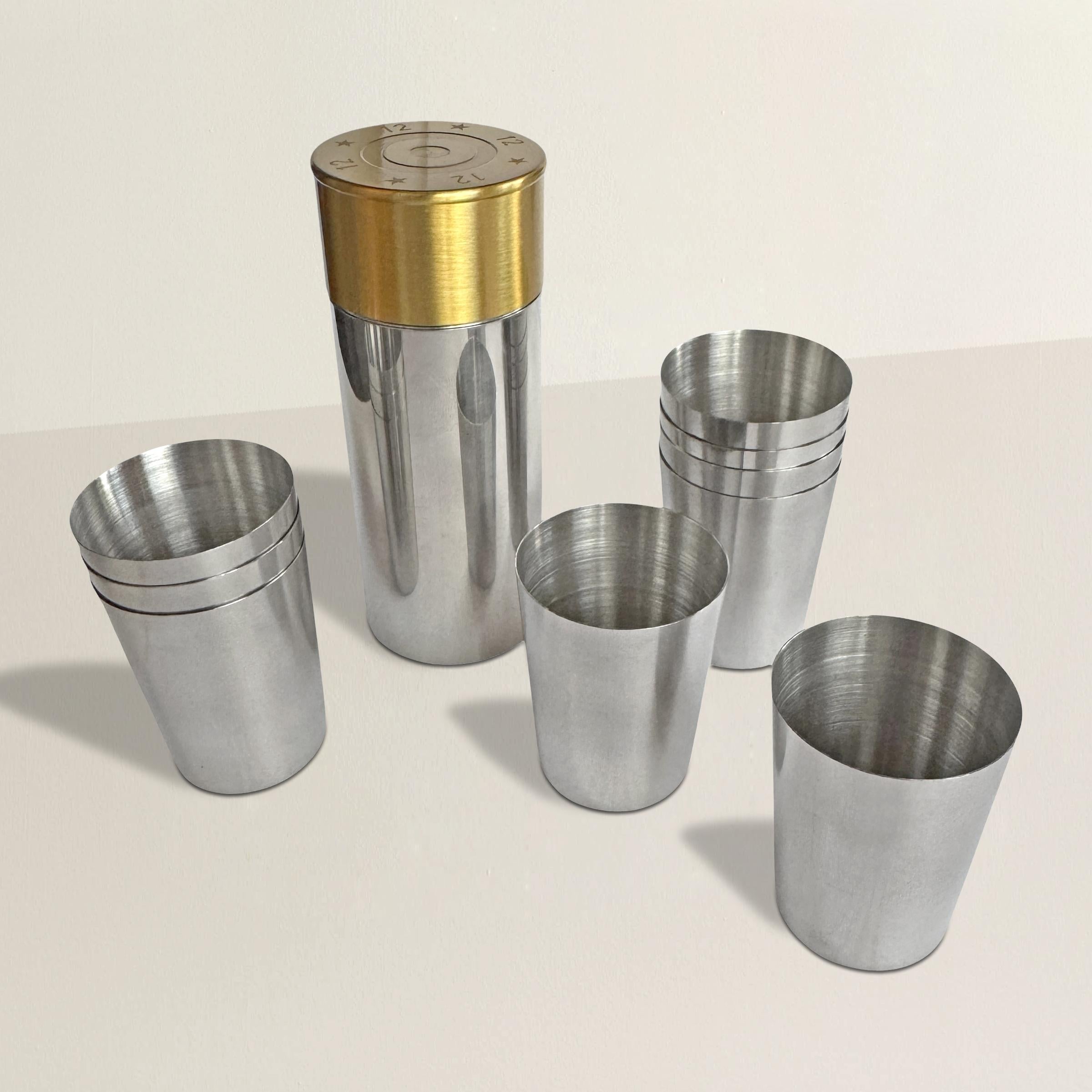 This clever English shooting peg set takes the form of an oversized 12-gauge shotgun shell canister, crafted in stainless steel with a gleaming brass lid. Uncap the lid, and you'll find nine stainless steel shot glasses nestled neatly inside. Each