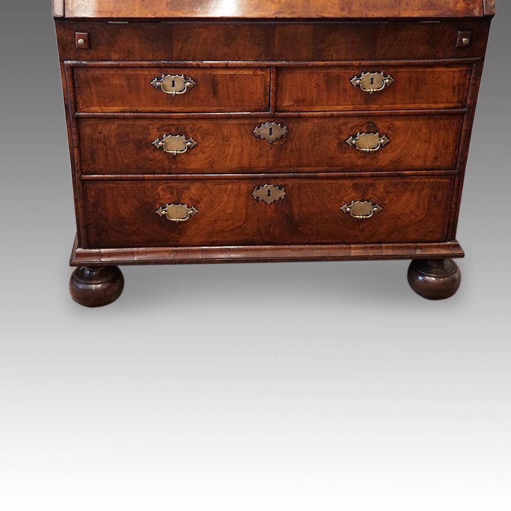 Queen Anne walnut bureau bookcase
This Queen Anne walnut bureau bookcase made circa 1705 with the lovely and most desirable feature of the ‘double dome’ with a further dome to the return.
Usually these bureau bookcases have mirror plate doors, but