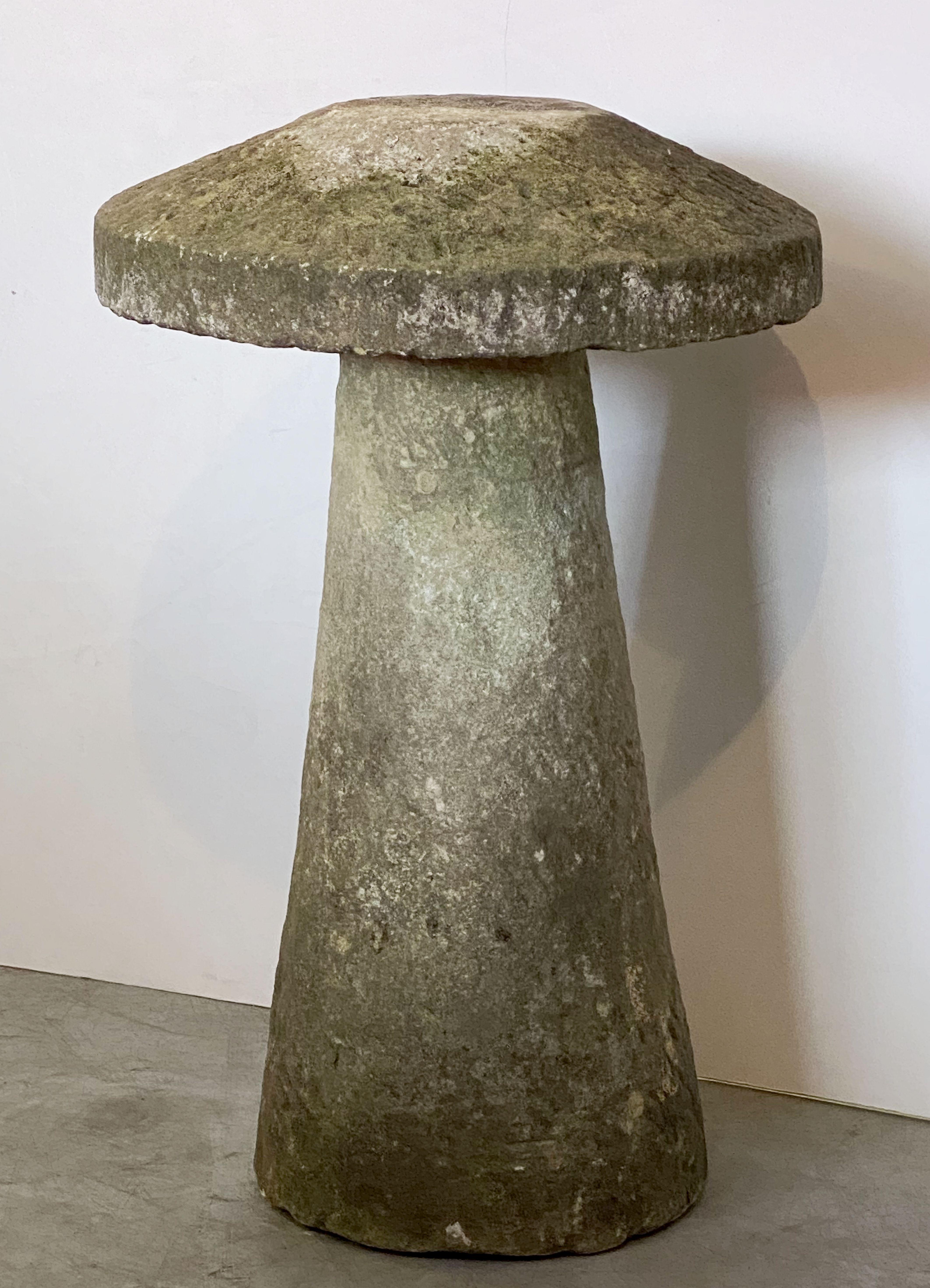 A steddle or staddle stone from the West Country of England, featuring a conical base mounted with a mushroom-shaped cap of quarried stone.

Use outdoors or indoors to create a contemporary or rustic English-garden effect. 
They are often used in