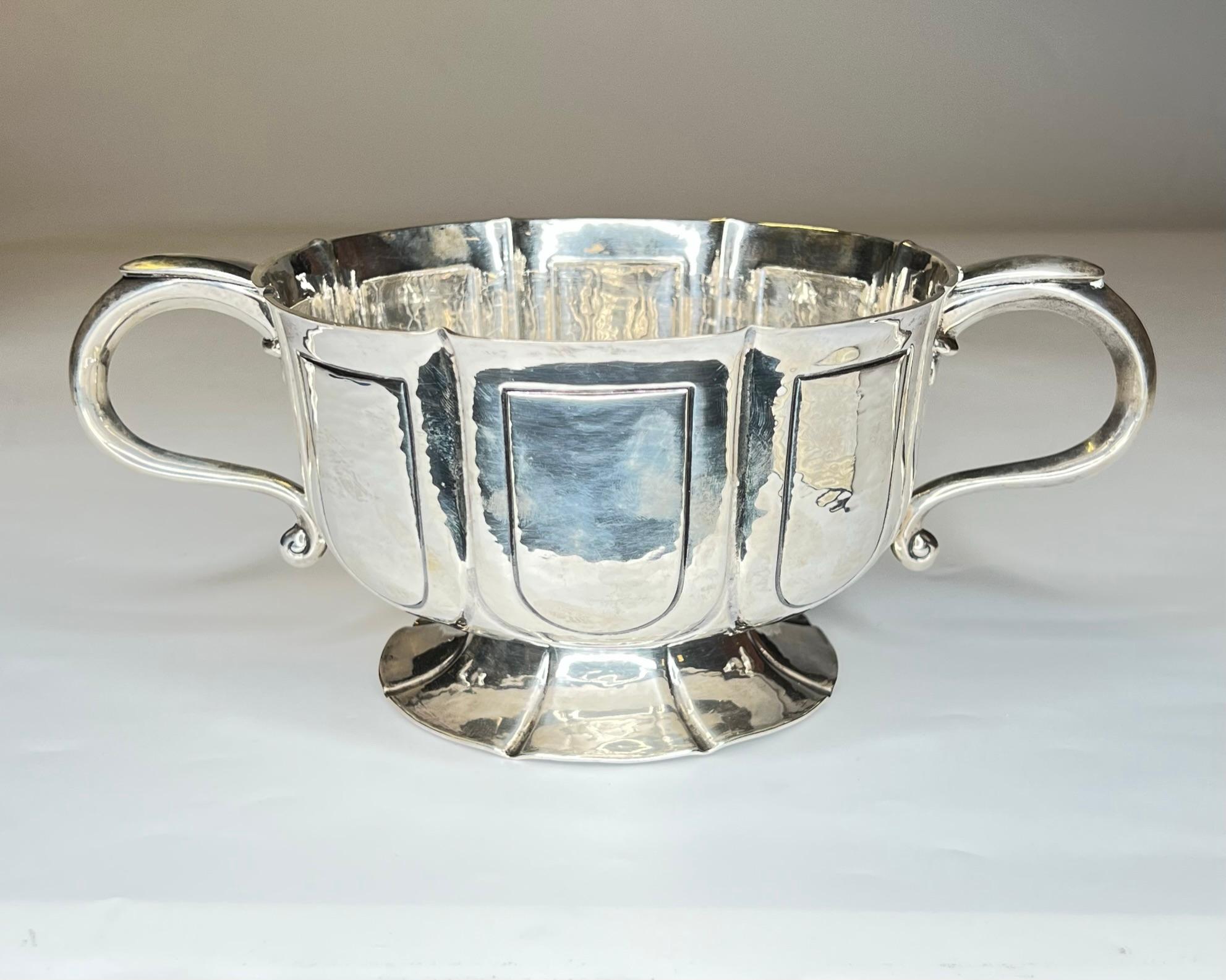 Our charming sterling silver handled bowl by the London master, William Comyns, dates to 1907 and is in very good condition. 24.4 oz, 694 g. An exceptional example of Edwardian period sterling.