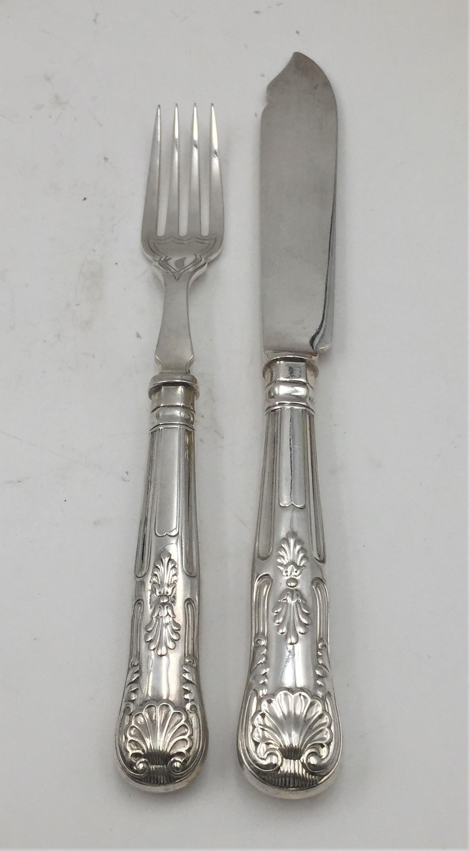 English sterling silver 24-piece fish set from 1928 with forks and knives with beautiful decoration in relief, similar stylistically and in terms of quality to Tiffany's Kings Pattern. The knives are hollow-handled (not weighted) and measure 8 1/2''