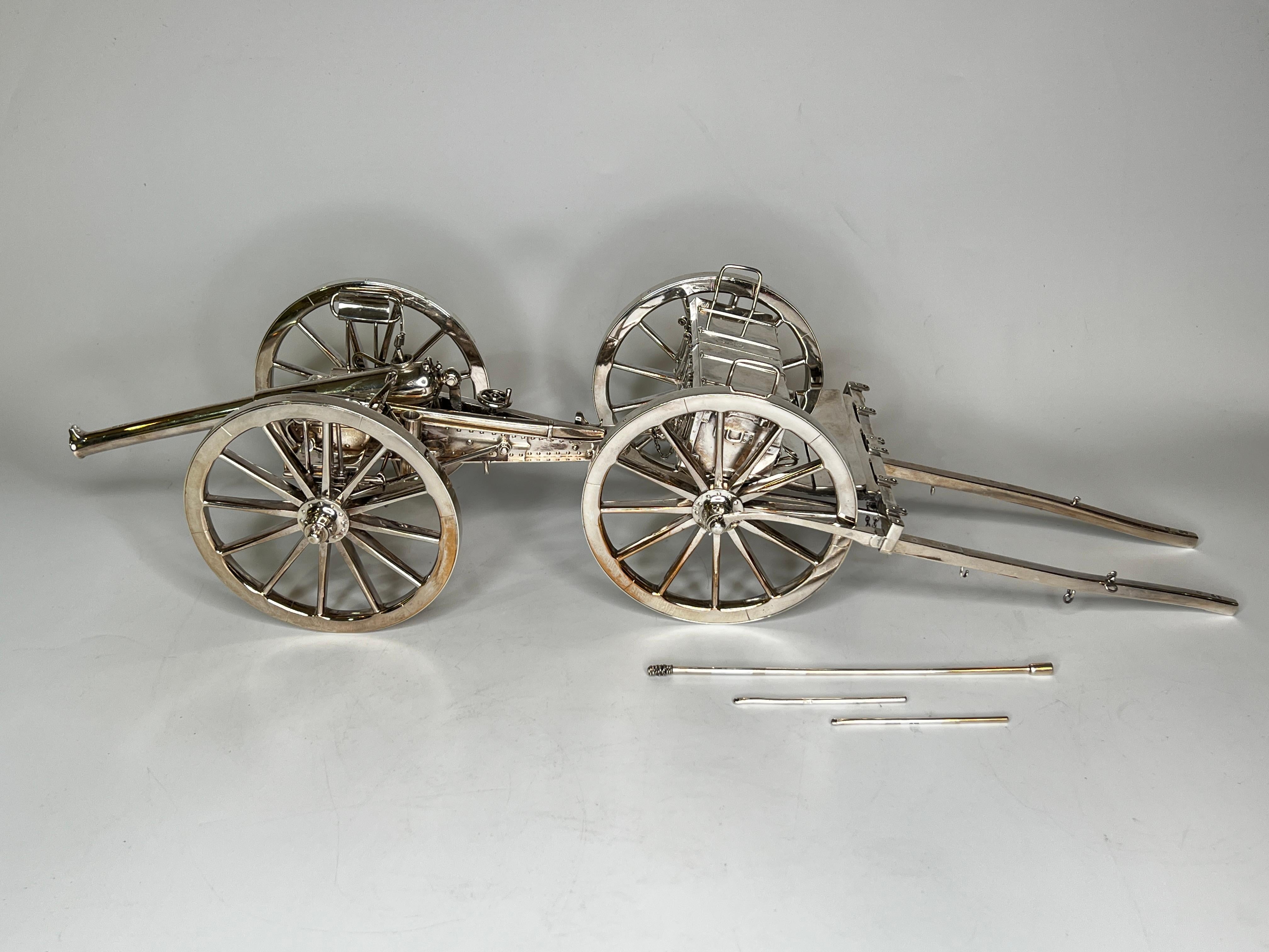 Our wonderful sterling lighter in the form of a gun carriage comprising cannon on cart and limber was made by the London silversmiths, William Gibson and John Lawrence Langman in 1893.

The finest example of its kind we have seen in decades, in