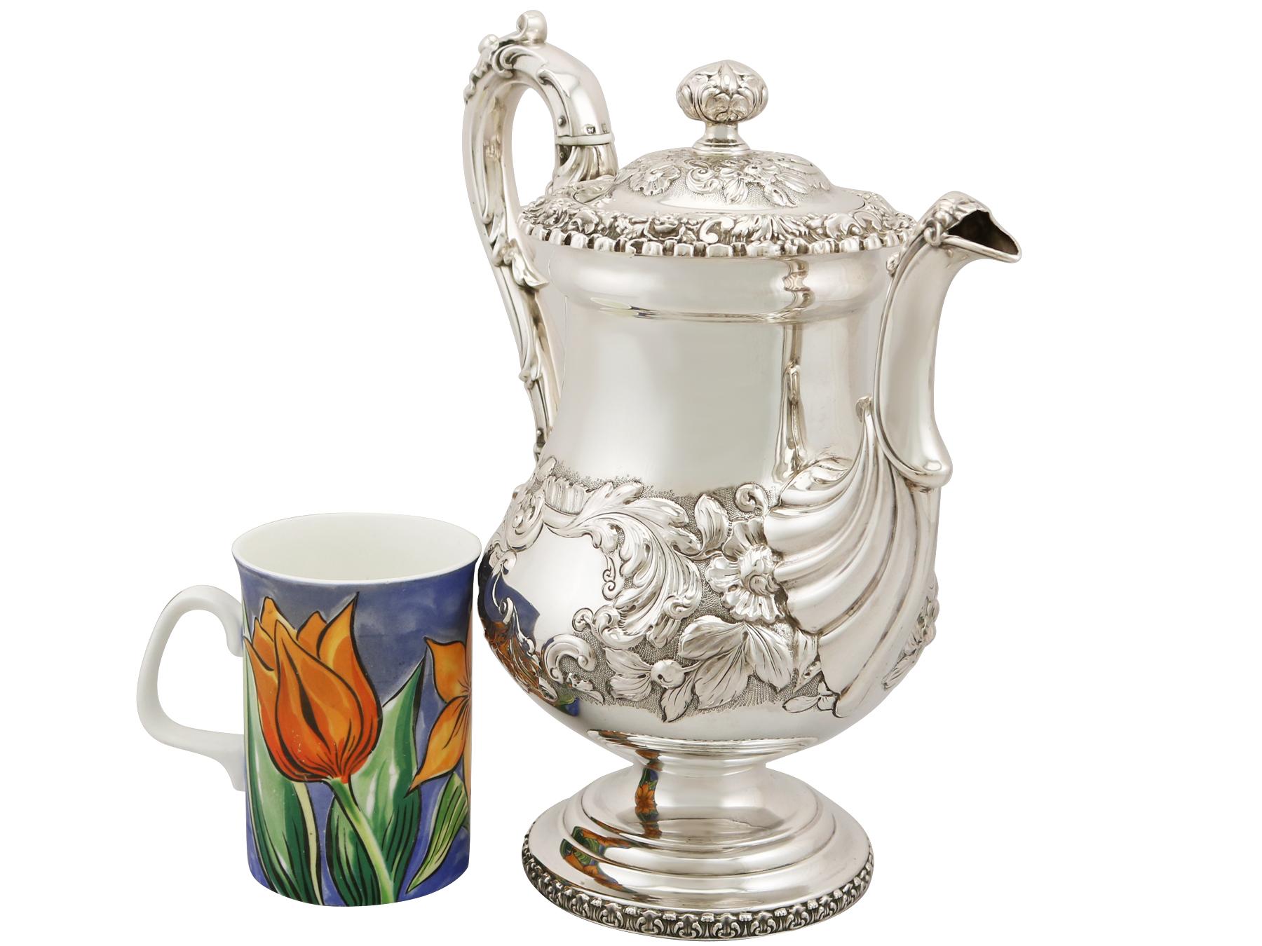 A fine and impressive antique George IV English sterling silver coffee pot; an addition to our silver teaware collection

This exceptional antique George IV sterling silver coffee pot has a baluster shaped form onto a circular pedestal