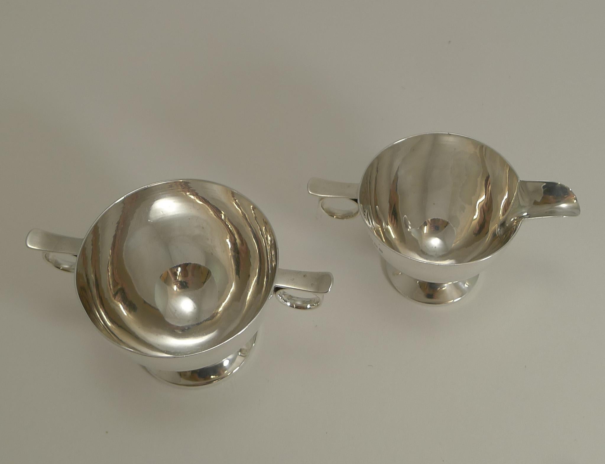 A fine quality and very stylish cream and sugar set made from a good heavy gauge of sterling silver with a very elegant Art Deco design.

Each piece is fully hallmarked for London 1935 together with the makers mark for Charles Boyton &