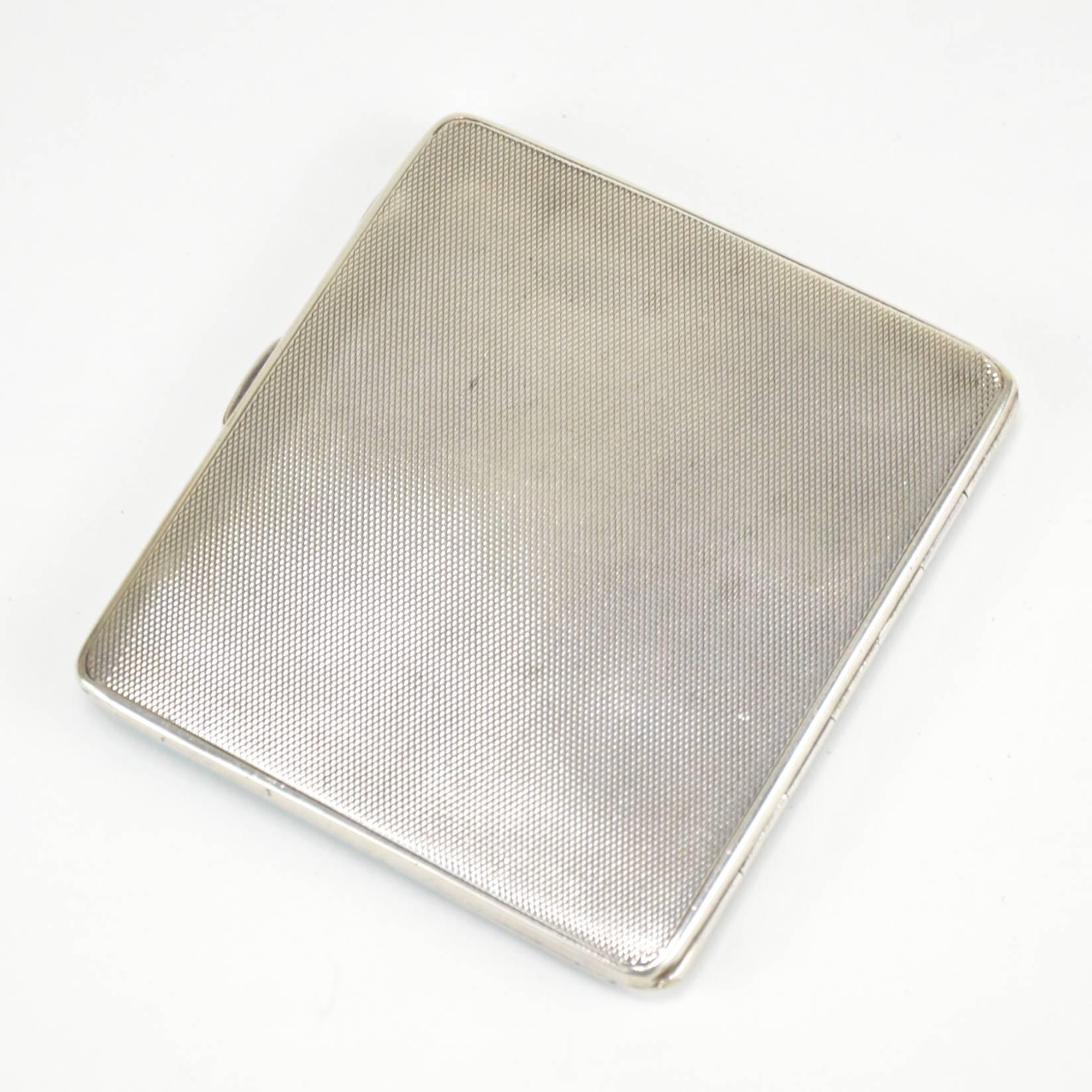 English sterling silver cigarette case. Light blue guilloché enamel, gilt inside.
Commemorative date engraved inside, 1935.
Dimensions: 9 x 8 cm.
Condition report: small chip in one corner (see the photos).
 