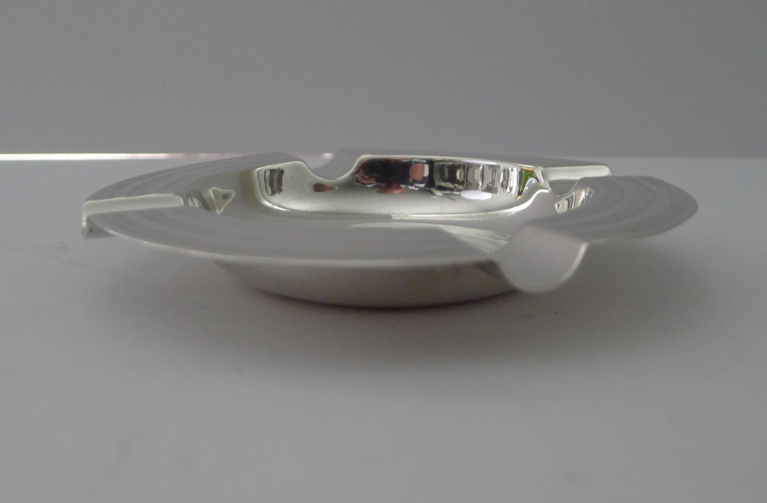 A magnificent Art Deco solid sterling silver ashtray made by one of the finest silversmith's, Goldsmiths and Silversmiths Co. Ltd; fully signed on the underside with the London address 