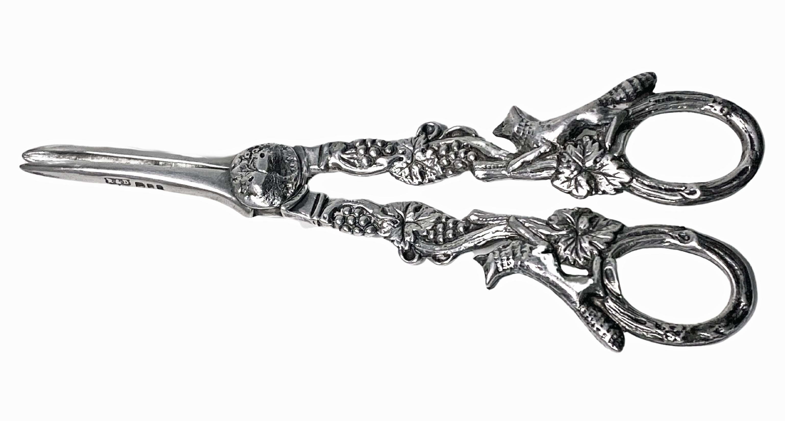 Pair of English Sterling Silver Grape Shears, running foxes design, London 1966, Roberts and Dore. The Shears with running foxes and vine grape design. Full hallmarks and hallmarked on detachable pieces. Length:- 6 1/4 ins; Weight:- 98.65 grams