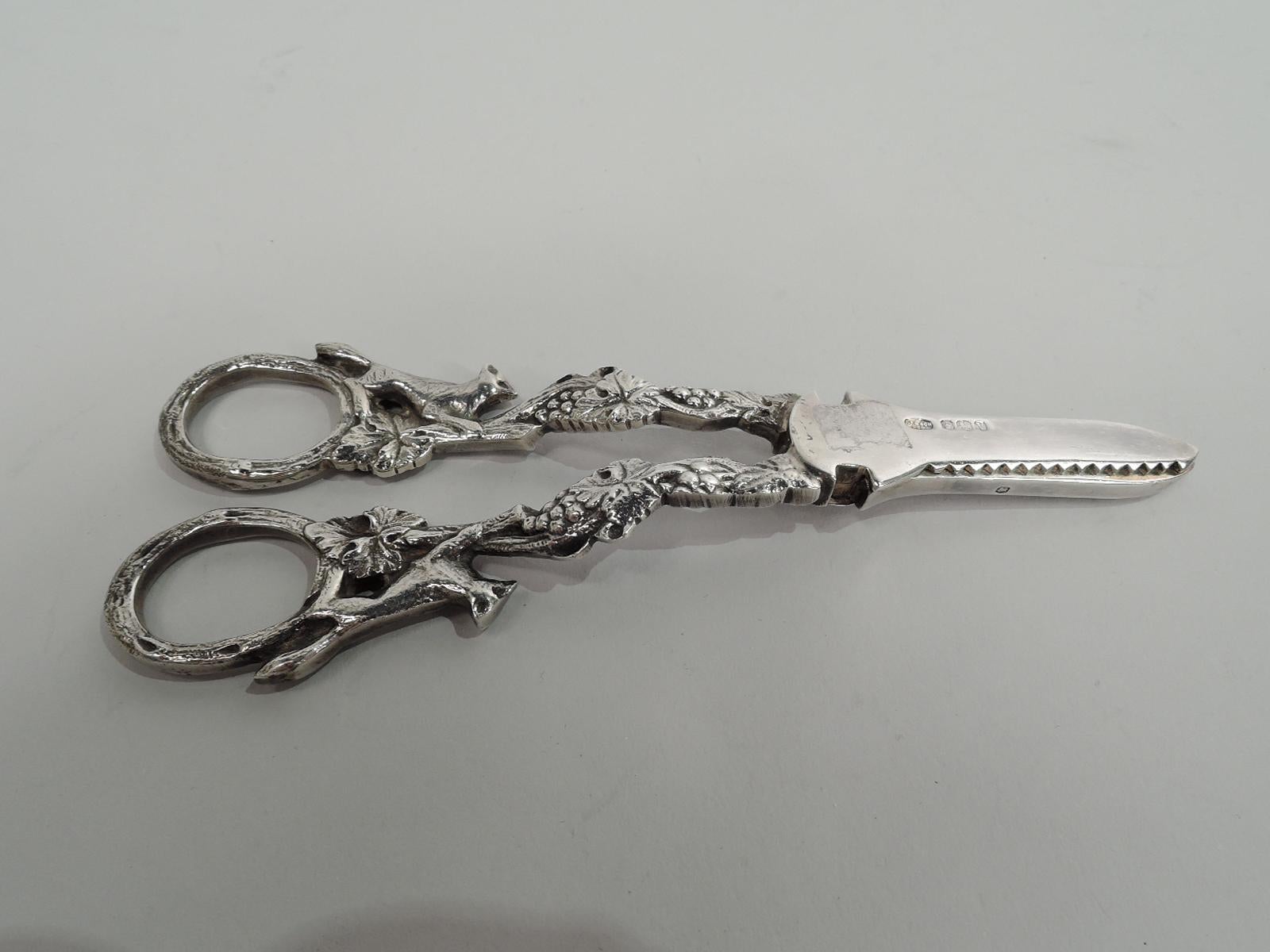 Elizabeth II sterling silver grape shears. Made by Israel Freeman & Son, Ltd in Sheffield in 1963. Double-sided fruiting grapevine handle and finger rings with foxes on hindlegs looking longingly at the out-of-reach bunches. A charming illustration