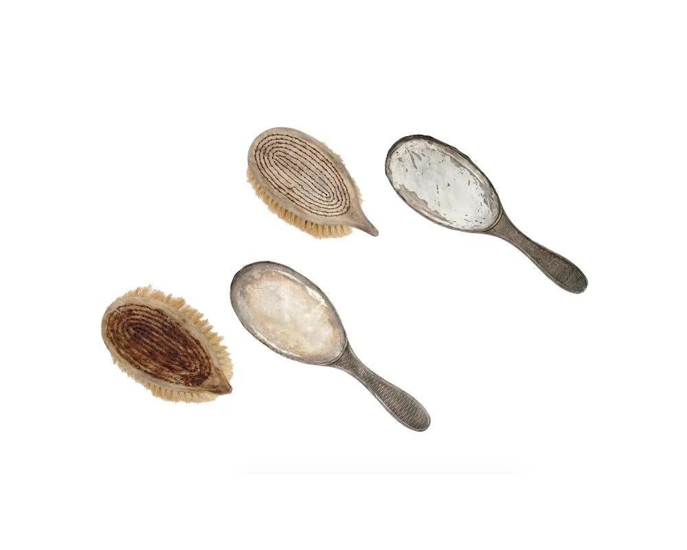 Cepillos ingleses de plata de ley para el pelo y la ropa siglo XX