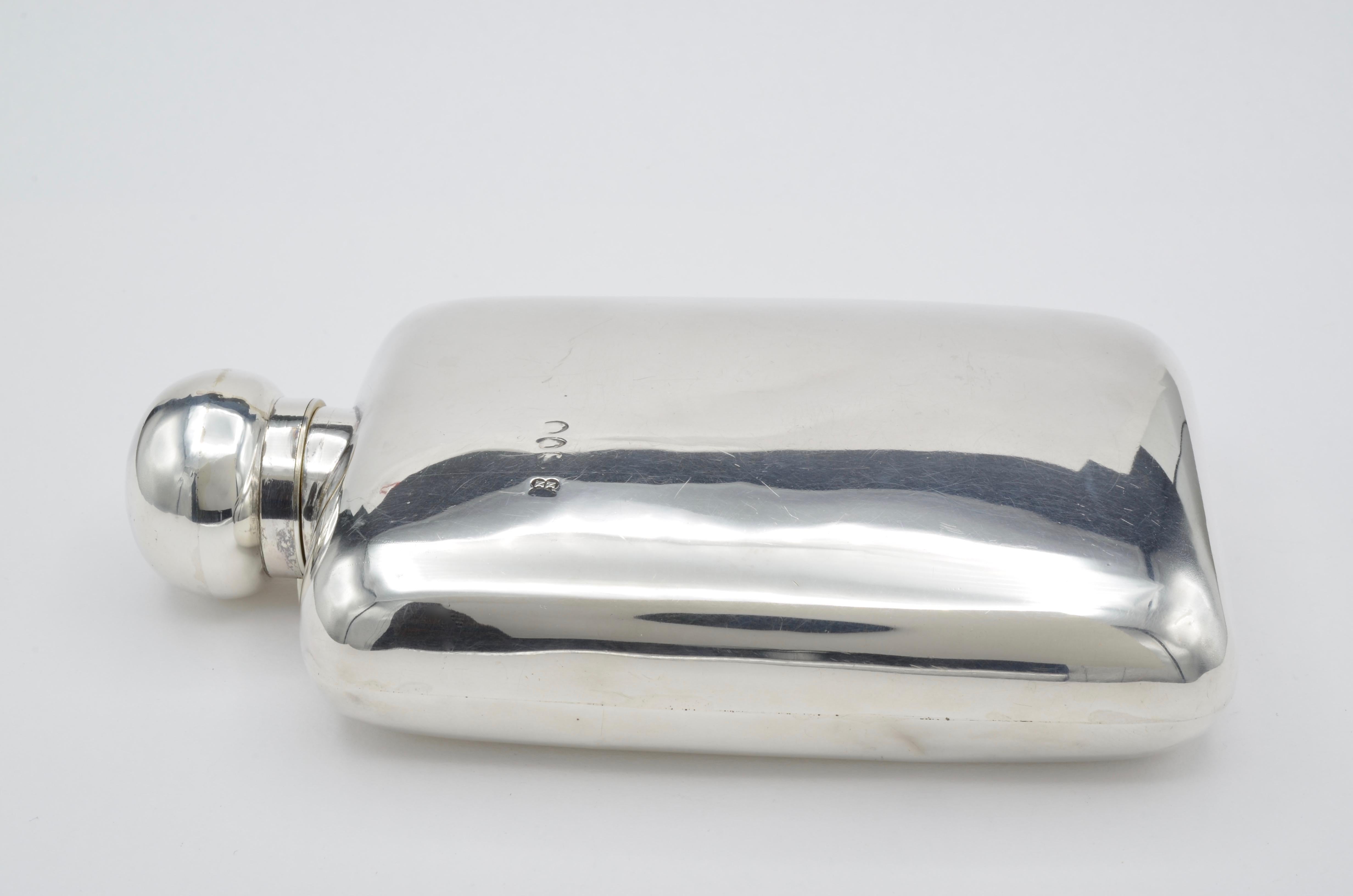 This beautiful sterling silver flask is from the 1860's. The screw top is well designed and secure. The feel of it is yummy smooth and fits nicely in your hand! Any occasion for 'warmth in a bottle' this flask is the key!
