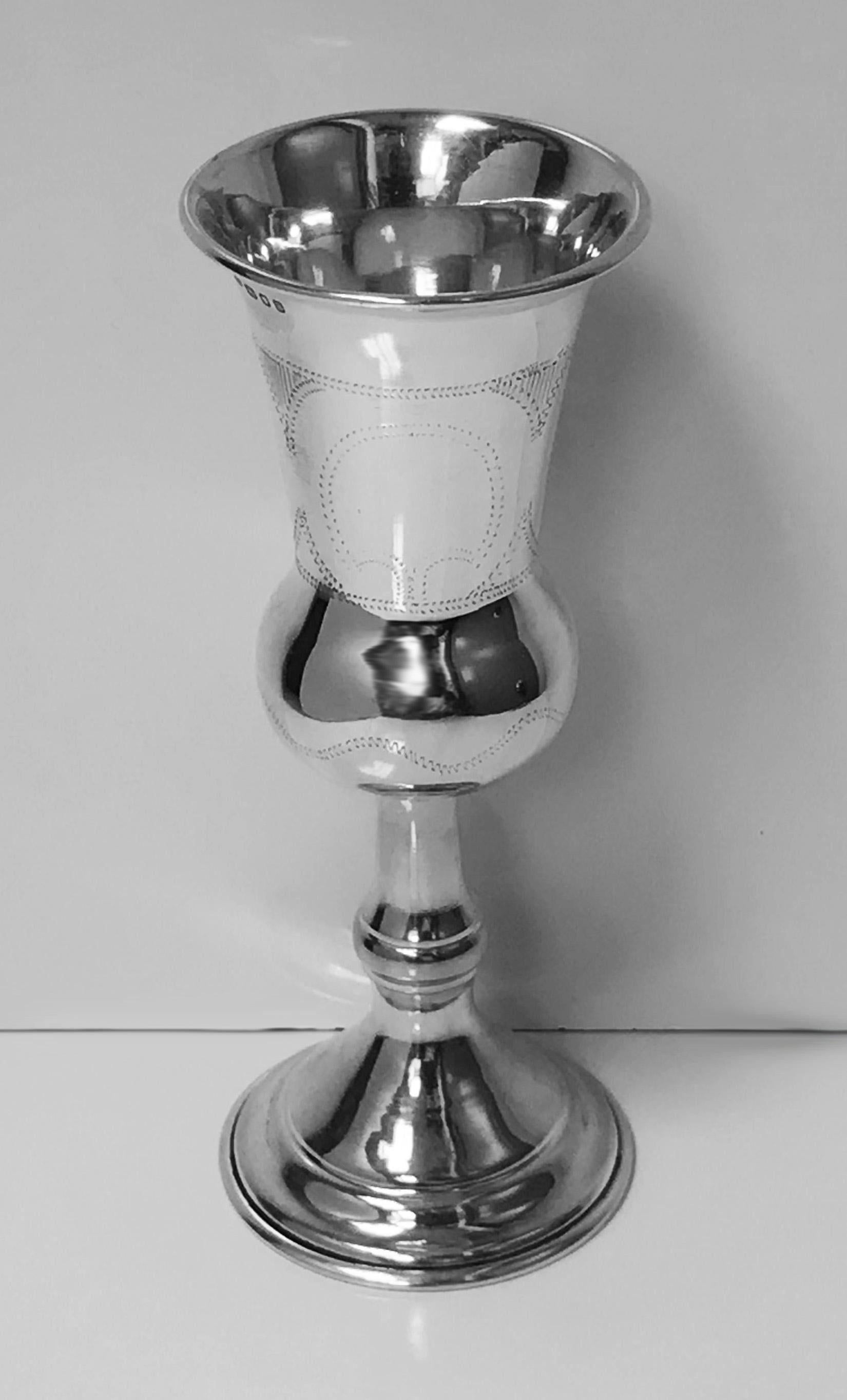 English sterling silver Kiddush cup goblet, London 1937, Morris Salkind. Campana shape on round dome circular pedestal foot, wriggle work pin prick engraved panels, one with vacant cartouche. Measure: Height 6.25 inches. Weight: 93.04 grams.