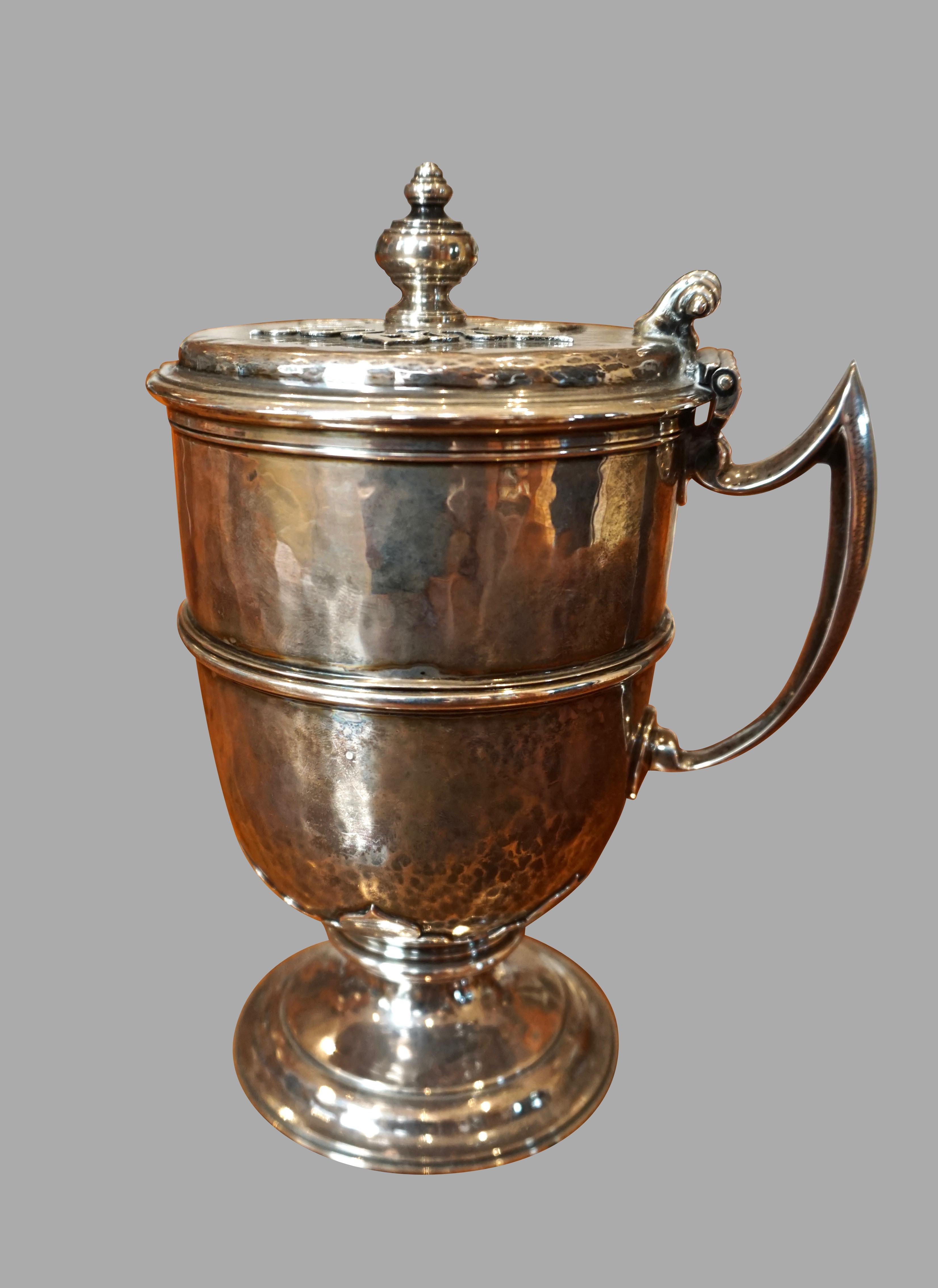 An English sterling silver covered handled cup hallmarked for London 1911, made and stamped by Johnson Walker & Tolhurst.  Weight is 19 troy ounces.