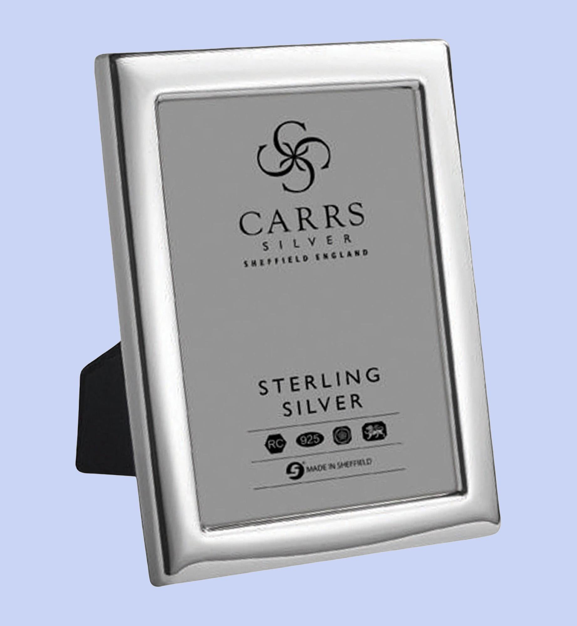 English sterling silver photograph frame is mounted on a blue velvet back. The elegant simple frame can stand both portrait and landscape. Size of photograph - 7 x 5 inches or 5 x 7 inches. Solid silver picture frames are manufactured in England