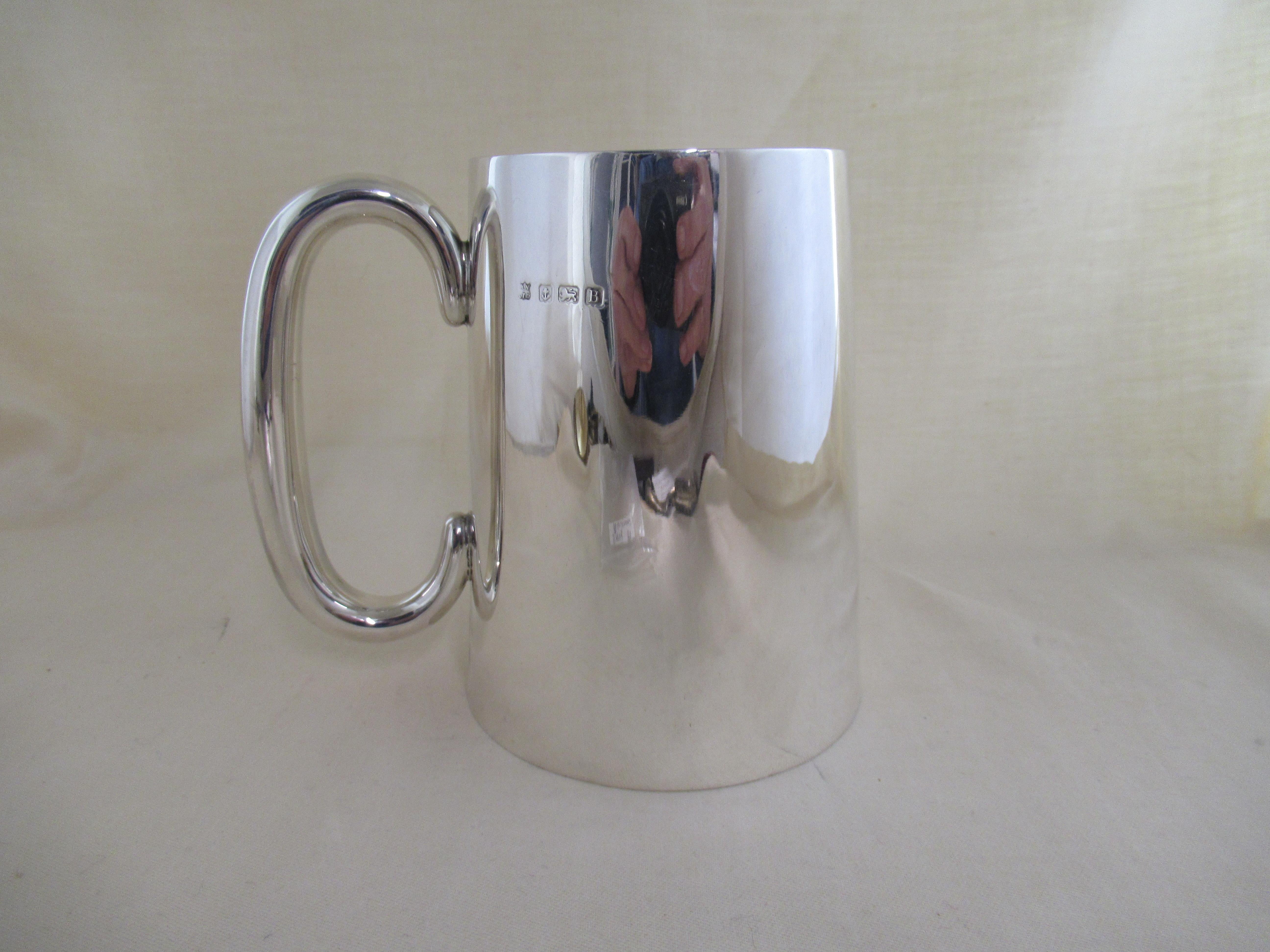 English Sterling Silver PINT TANKARD MADE IN 1926.
Fully hallmarked for Birmingham 1926
With the maker`s mark - W.N over LTD, for William Neale & Son Ltd.
 Warstone Lane, Birmingham.

A superb pint tankard, in absolutely unused condition.
The