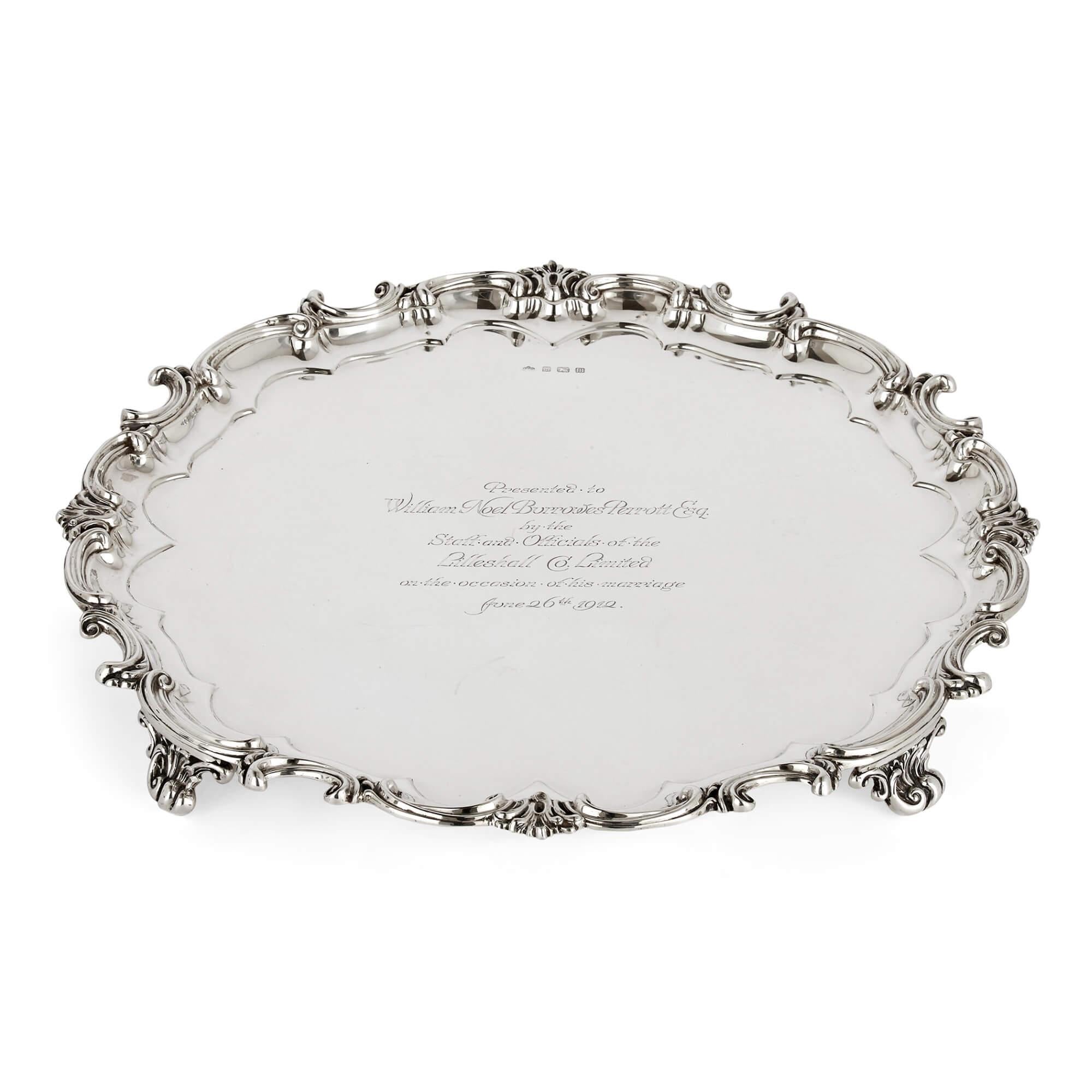 English Sterling silver tray with case by Elkington
English, 1911
Tray: Height 5cm, diameter 51cm
Case: Height 8.5cm, width 55cm, depth 55cm

This charming solid silver tray is by the famous firm Elkington. The tray is circular in shape, with a