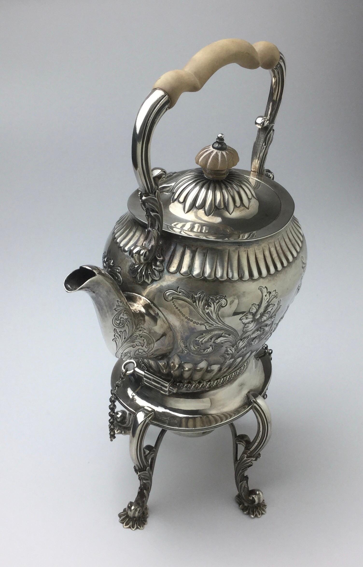Beautifully made English sterling silver tip kettle. Stands 12 1/2” tall by 8” wide by 5” deep. Three pieces all hallmarked. Wonderful age appropriate condition. No digs or dents. Some minor ware to the lock pins.