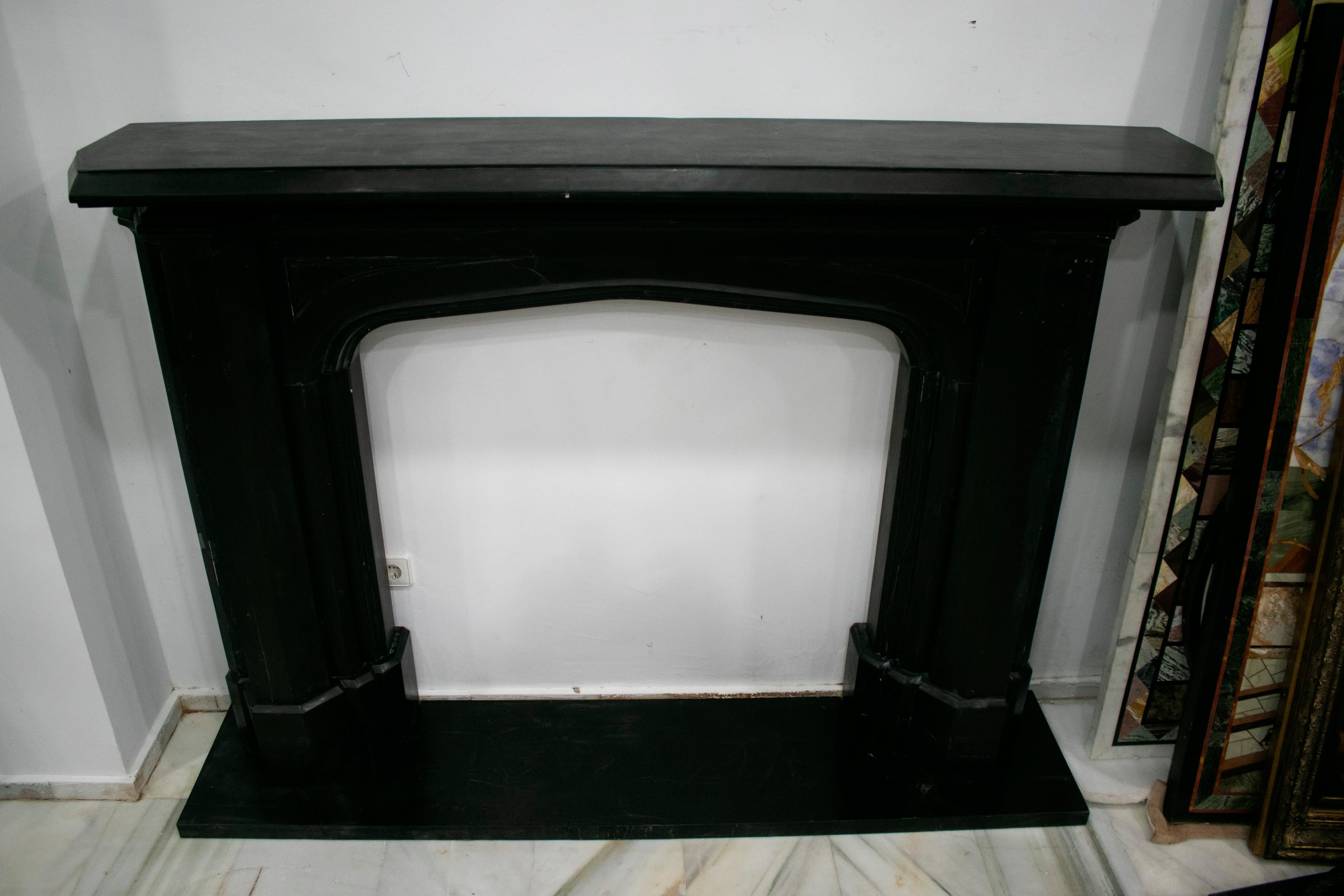 English style black Belgium marble hand carved fireplace mantel.