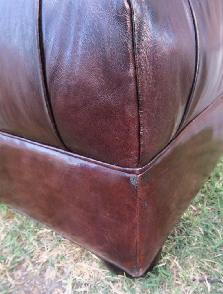 English Style Leather Tufted Ottoman with Bun Feet at 1stDibs