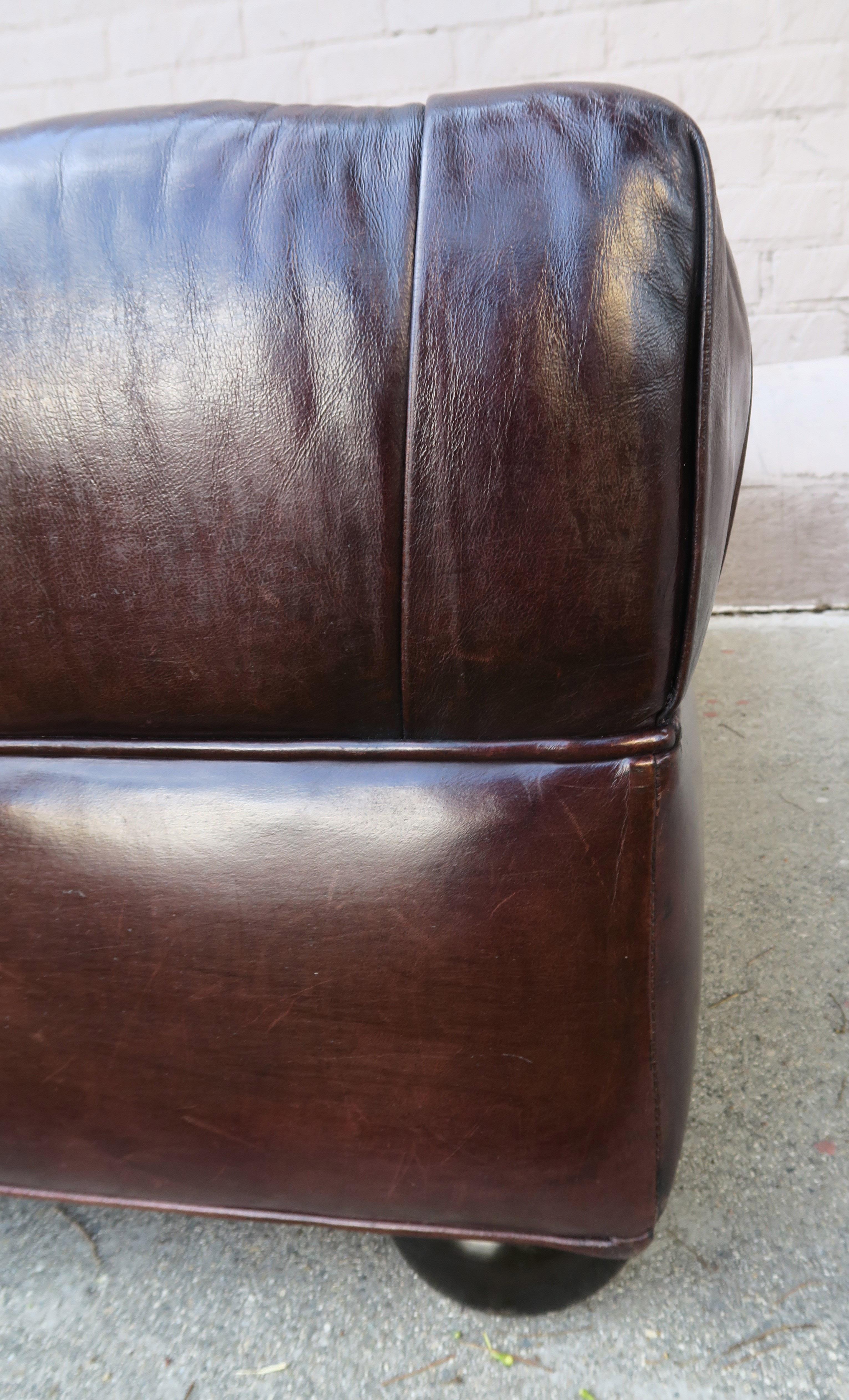 English Style Leather Tufted Ottoman with Bun Feet In Distressed Condition In Los Angeles, CA