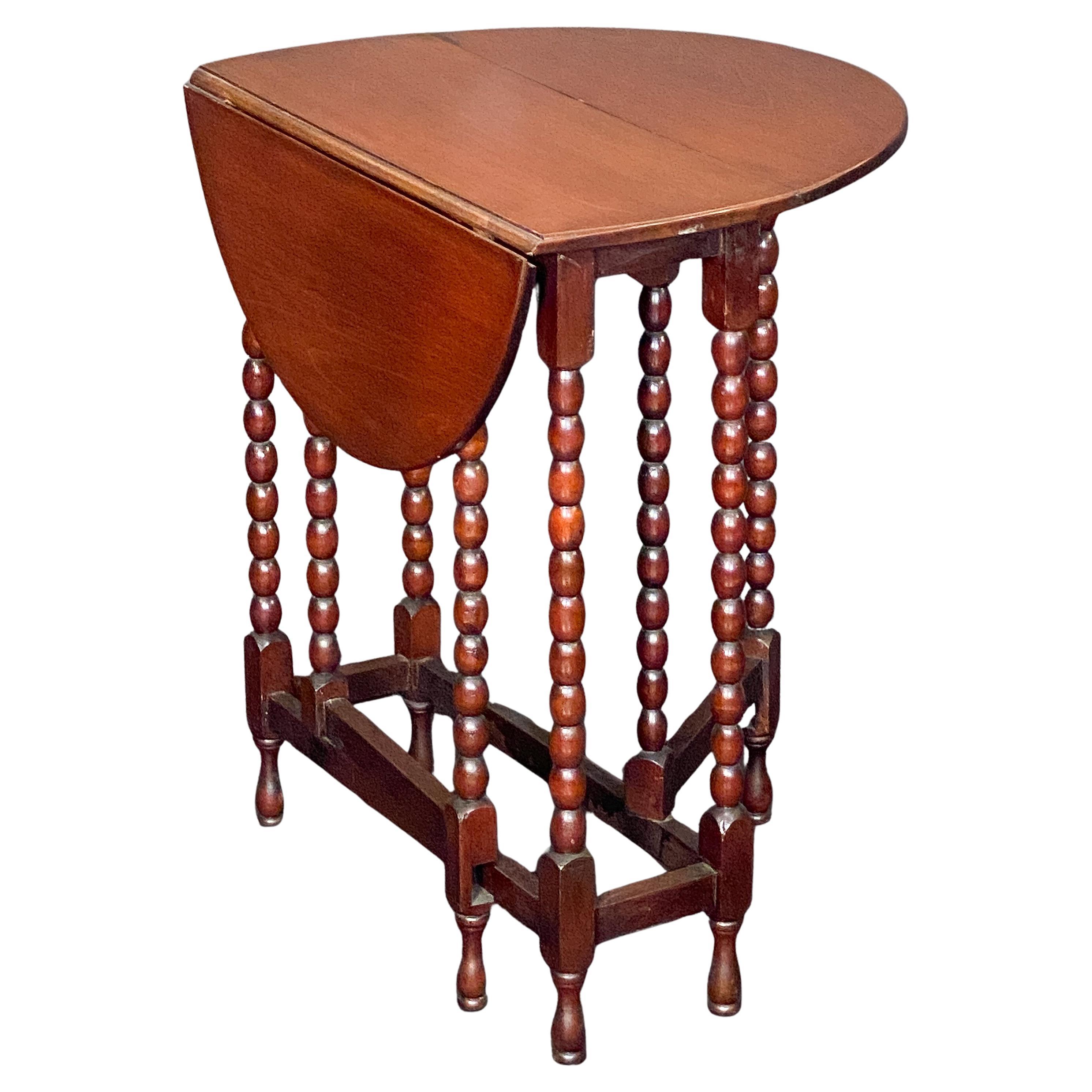 English Sutherland Drop-Leaf Table of Mahogany upon Turned Bobbin Legs For Sale